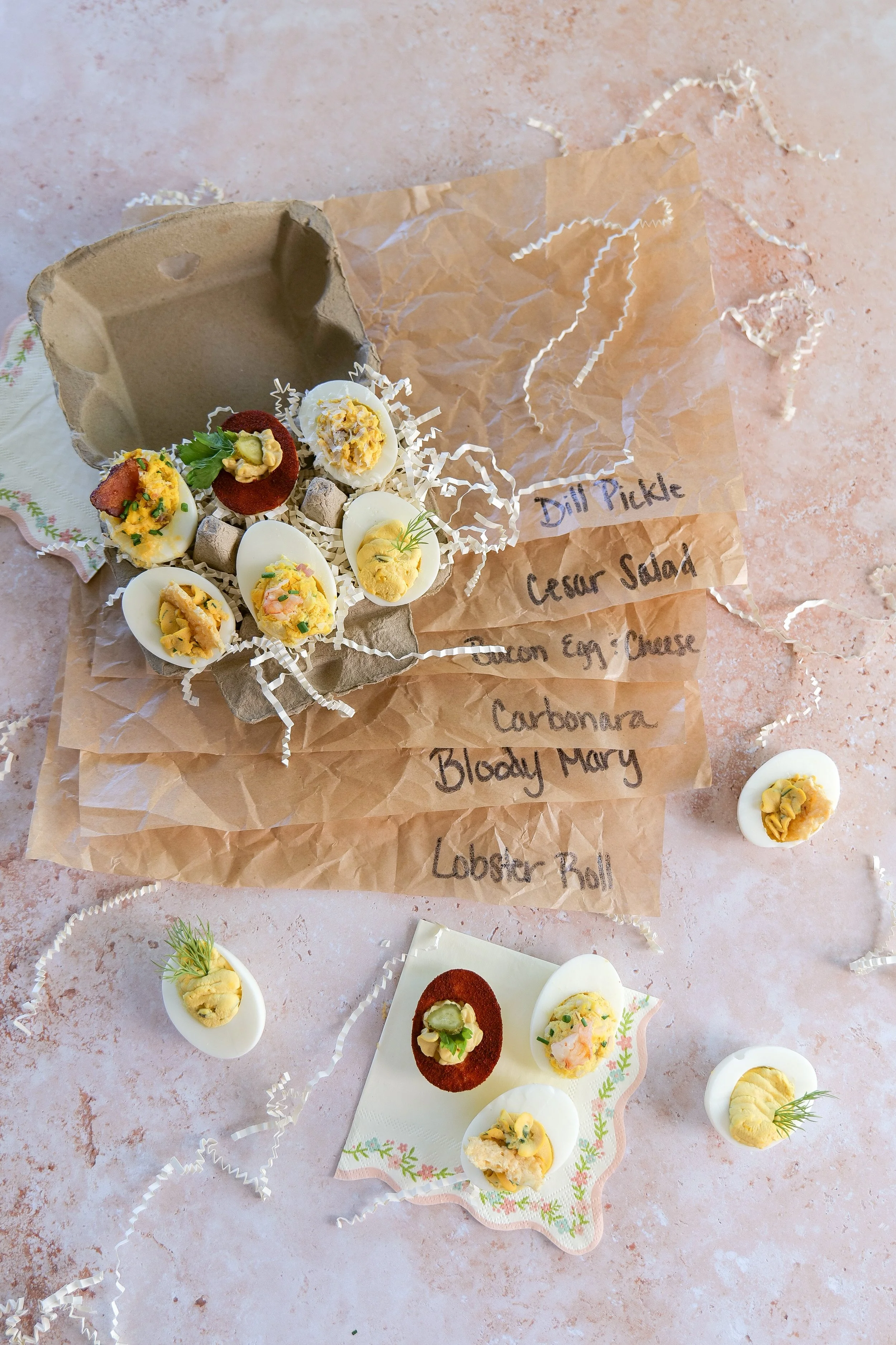 Six different deviled egg recipes arranged on a serving platter
