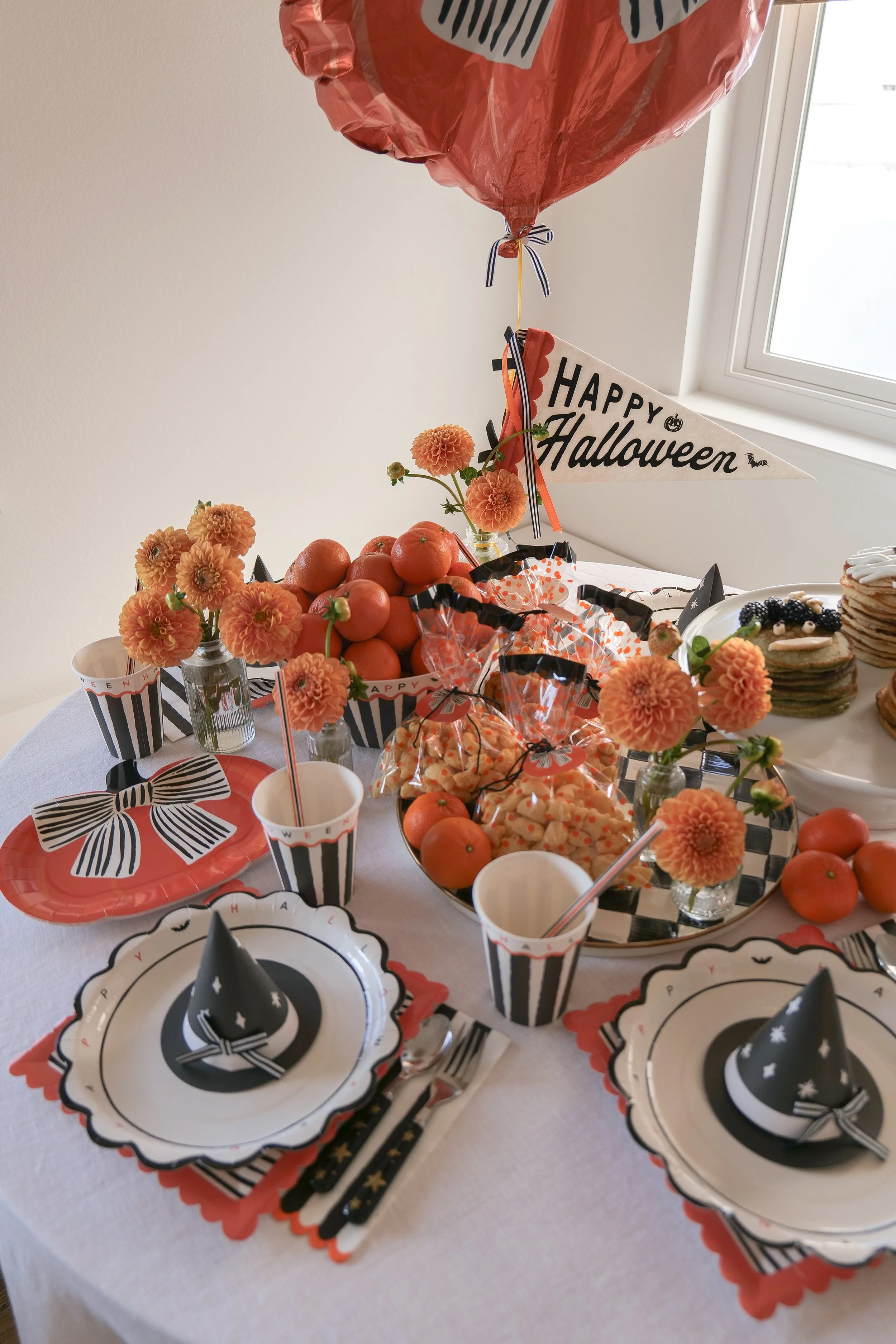 Halloween place setting for kids at a festive breakfast table.