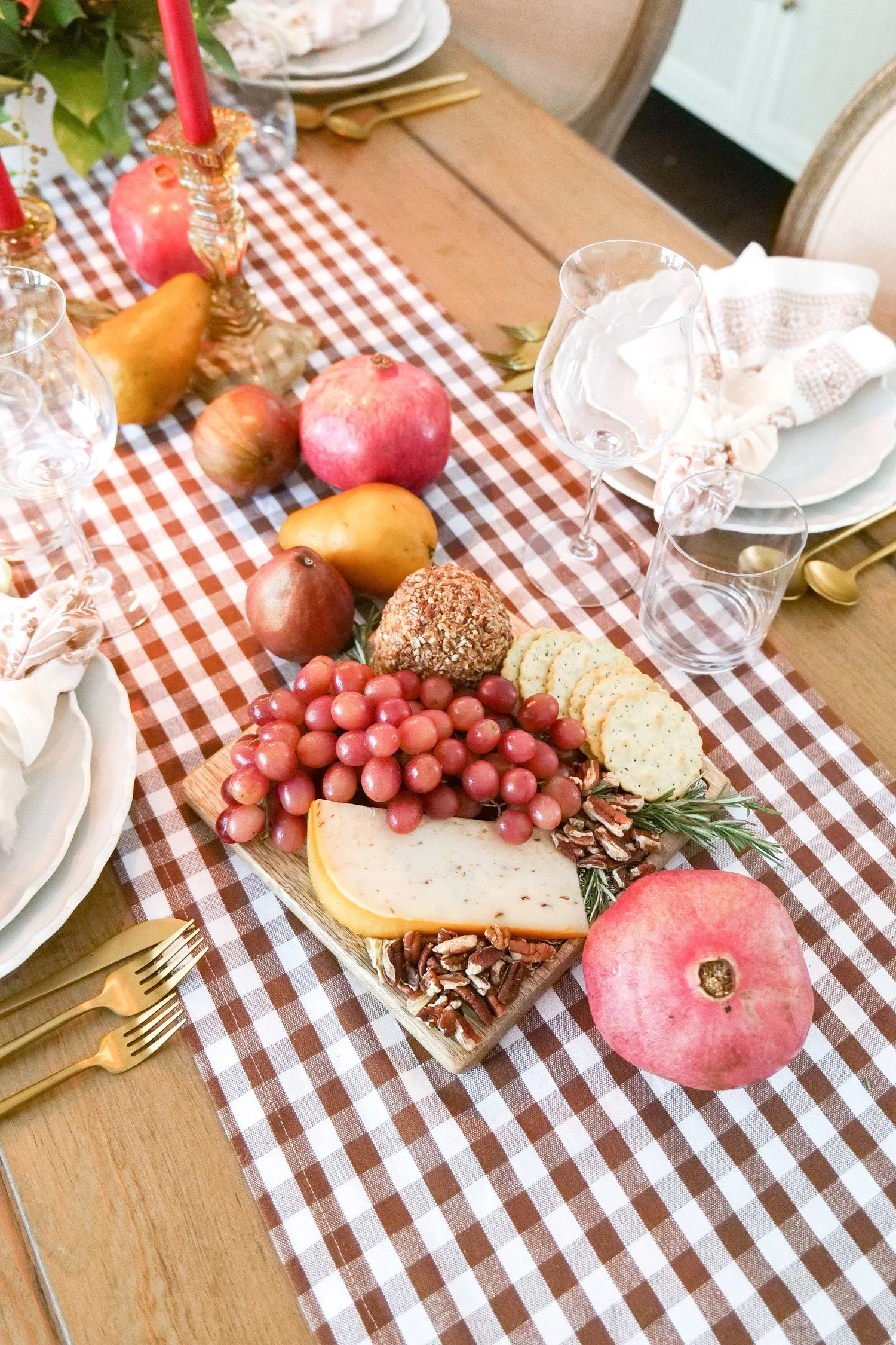 Fresh pears and pomegranates used as fall table decor
