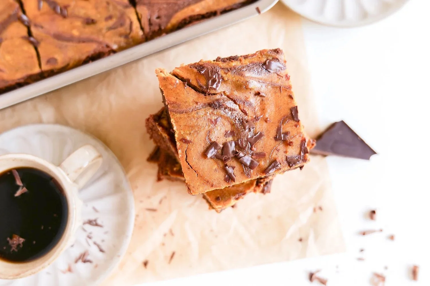 Rich chocolate pumpkin swirl brownies with a marbled spiced pumpkin topping.