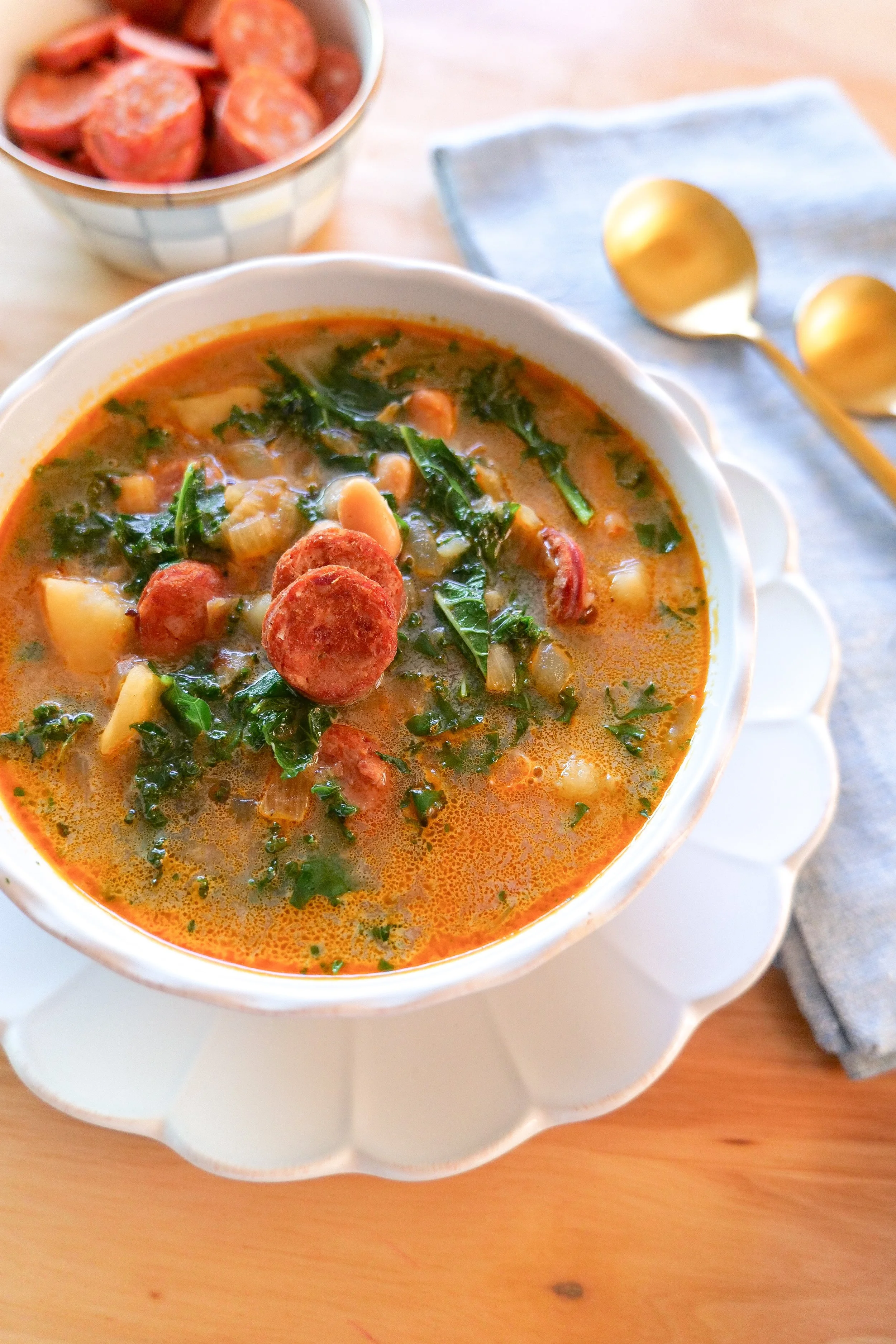 Portuguese sausage and kale soup made with sliced linguiça and tender Yukon Gold potatoes.