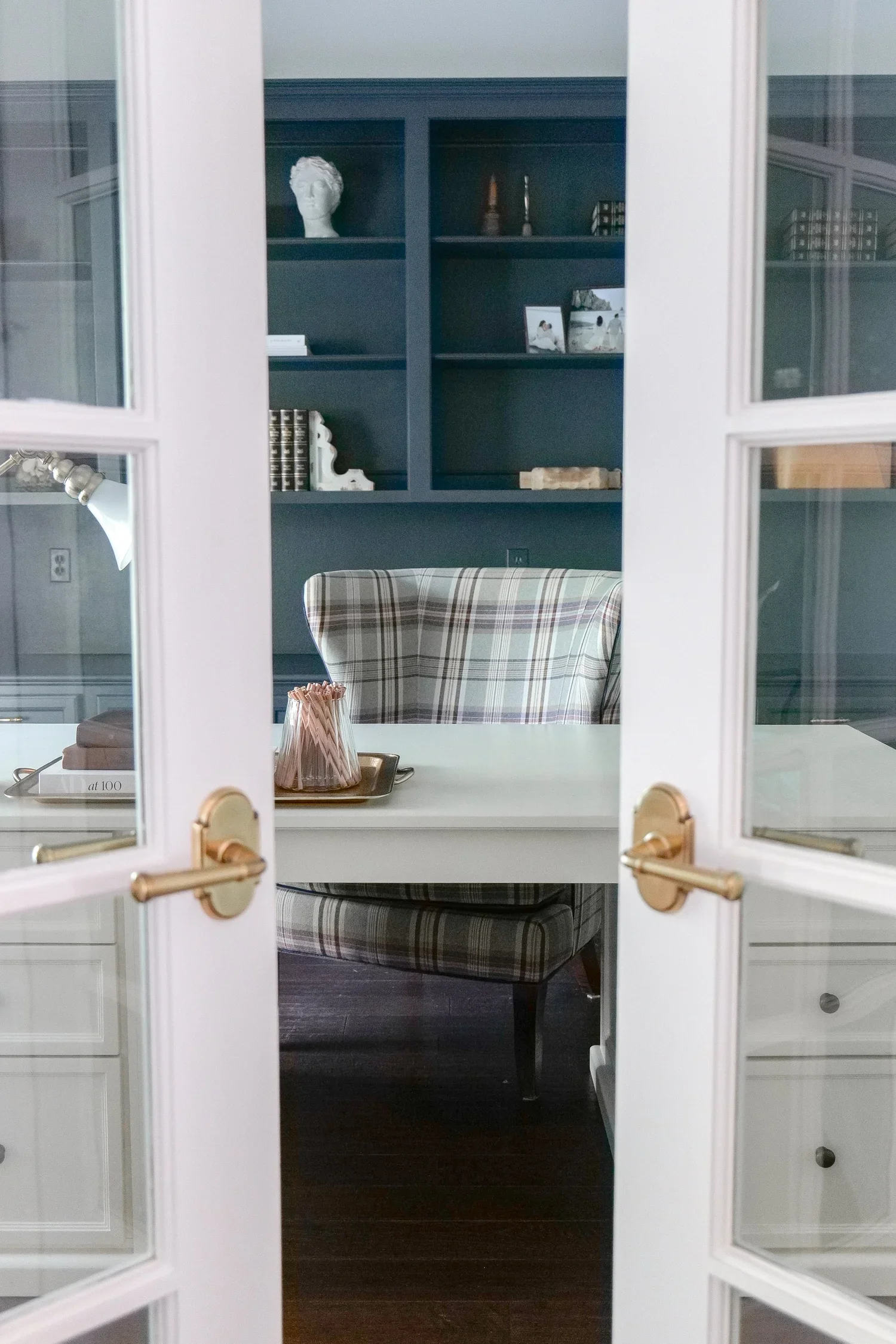 French country style hallway with upgraded interior door knobs and warm neutral finishes.