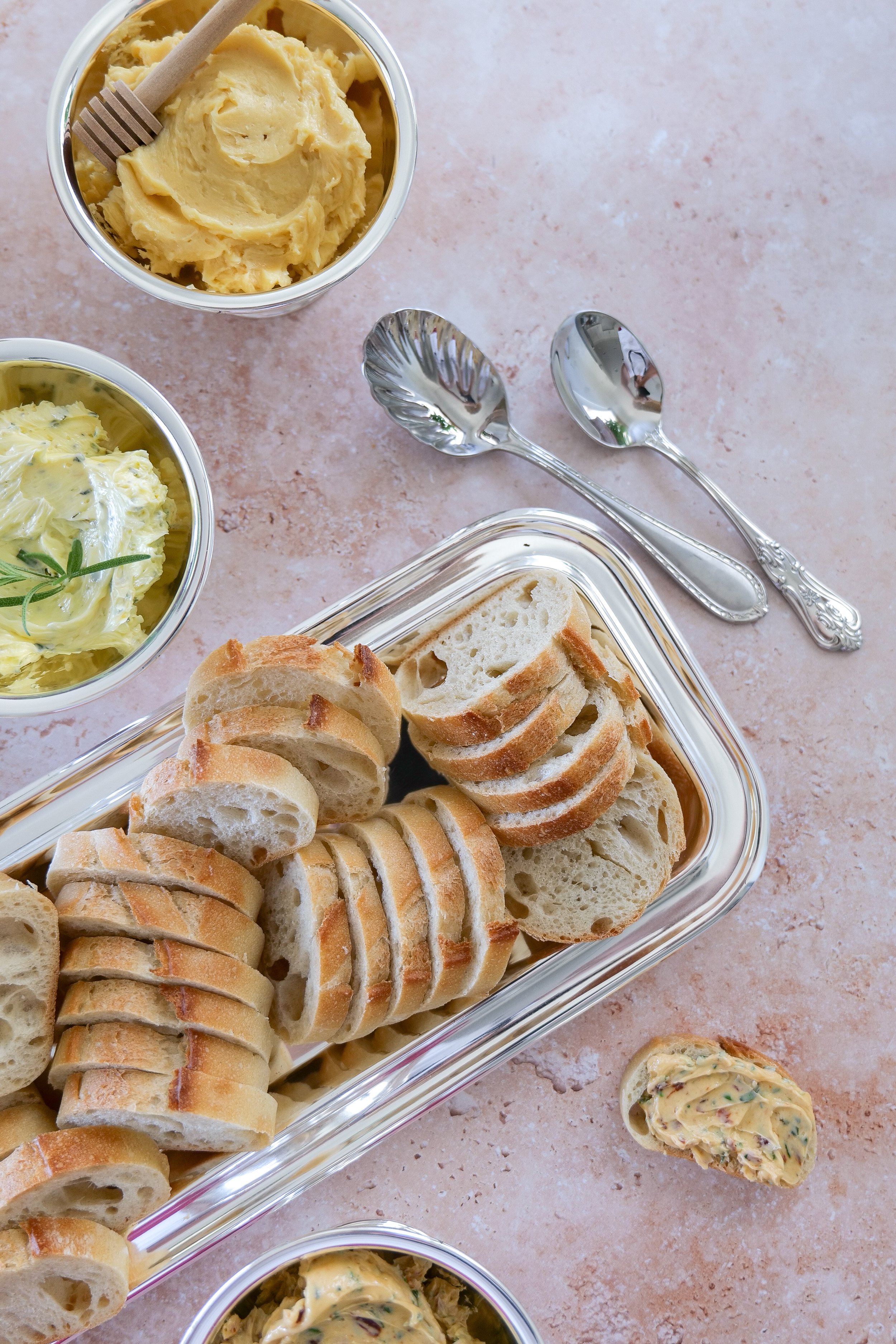 Three easy compound butter varieties paired with toasted baguette slices