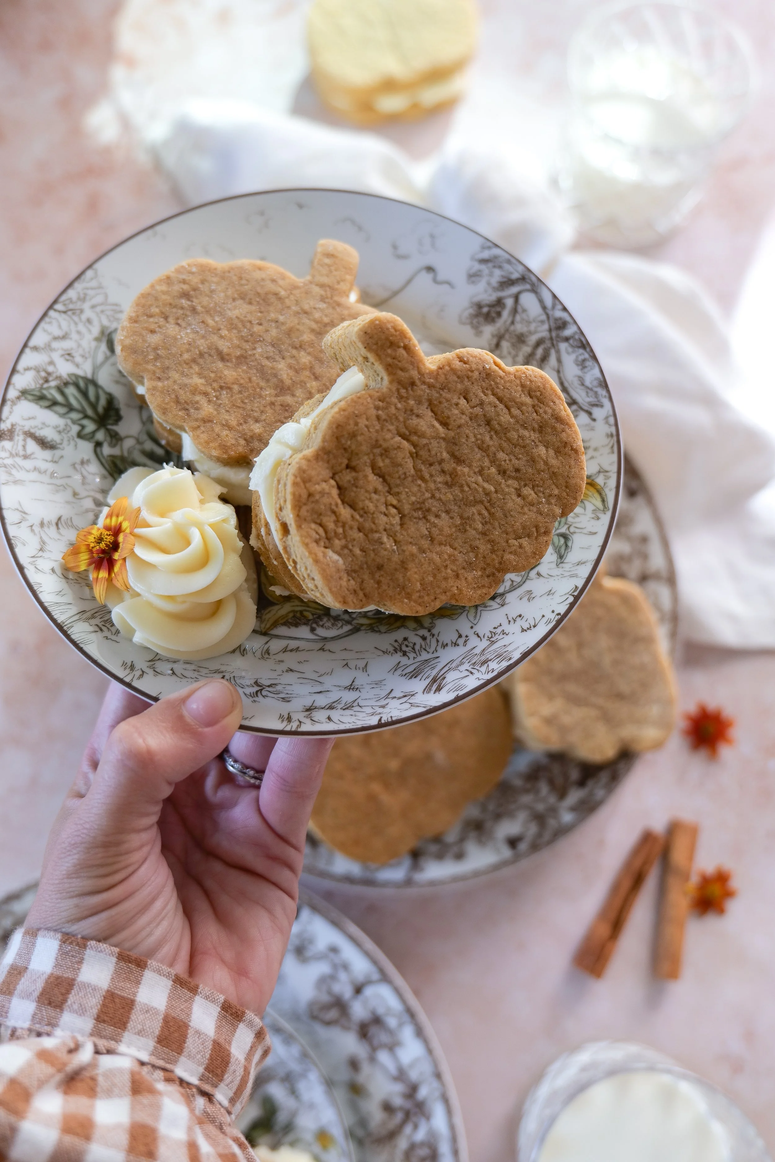 Finished brown butter pumpkin sandwich cookies arranged for a cozy fall baking day
