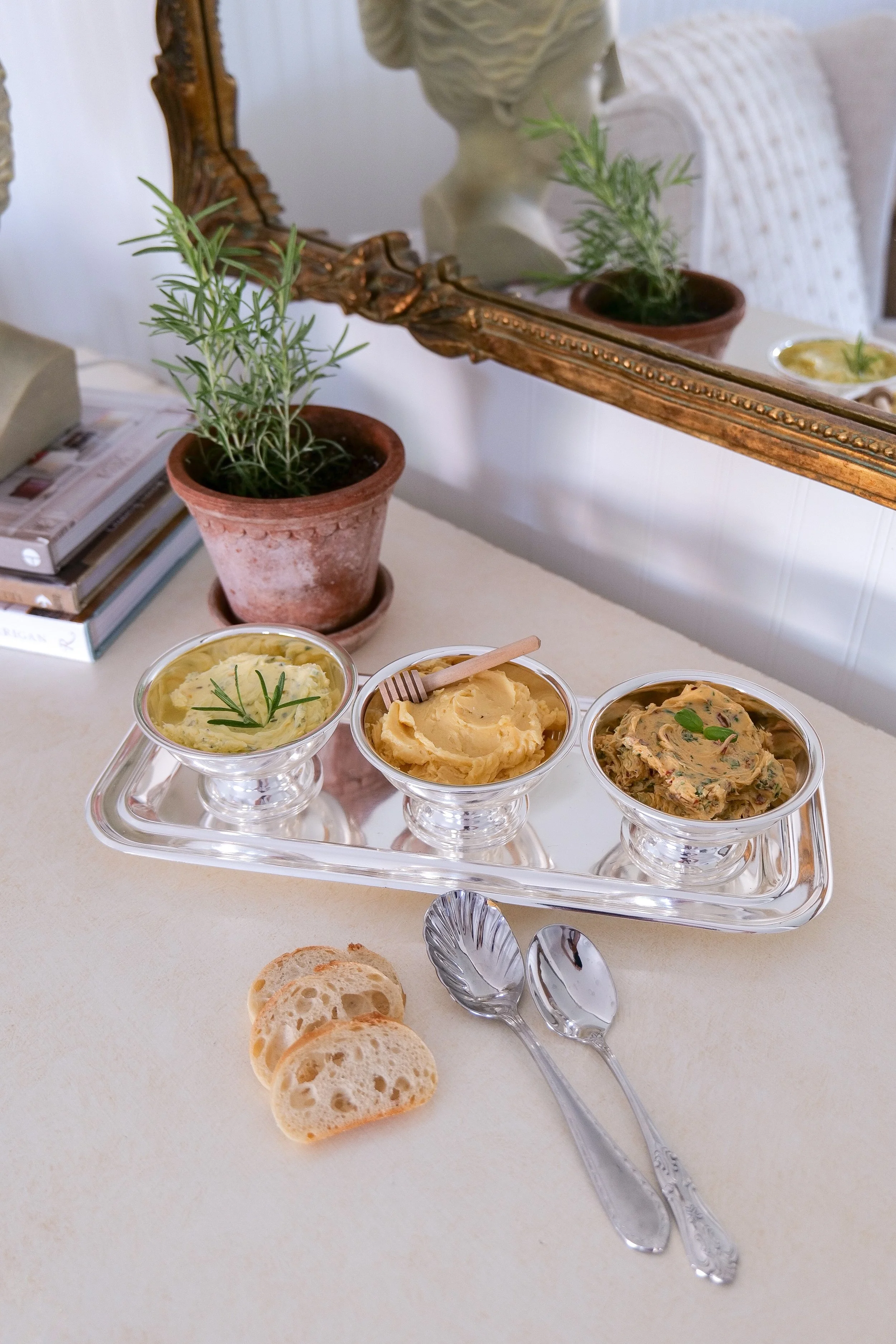 Homemade compound butter trio served in a small metal container