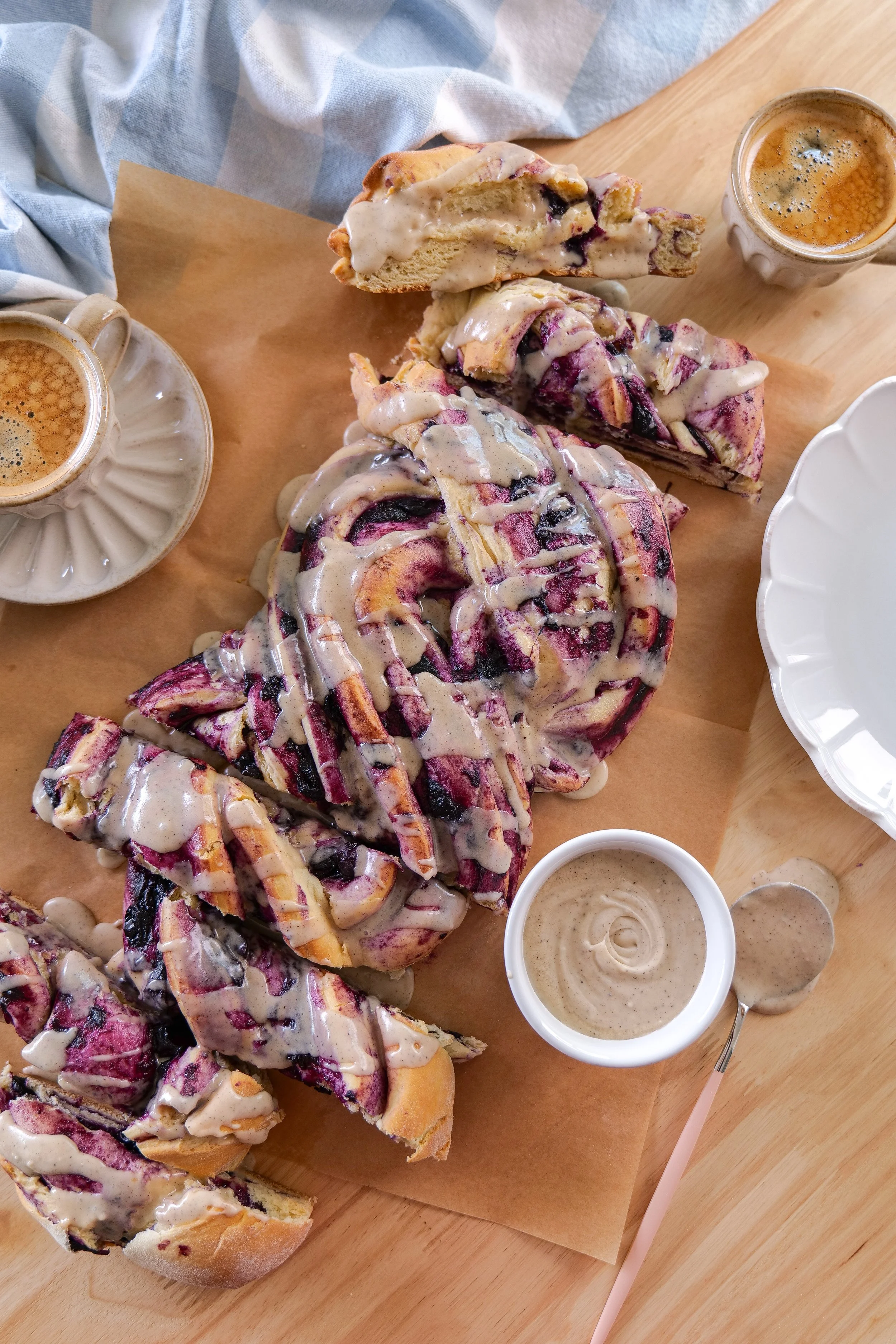 Close-up of blueberry-filled swirls in a homemade cinnamon roll loaf.