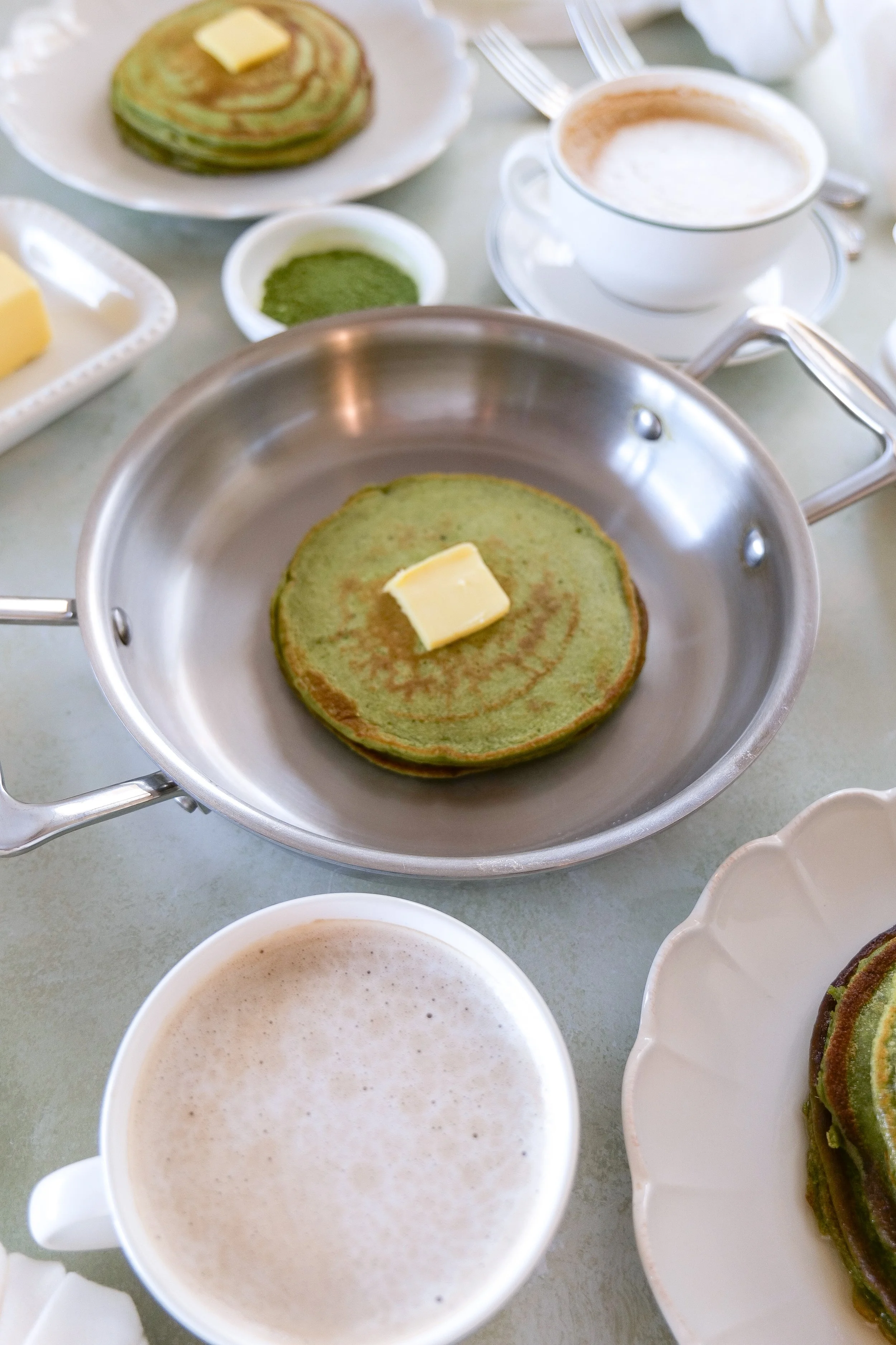 Light and fluffy matcha sourdough discard pancakes with butter