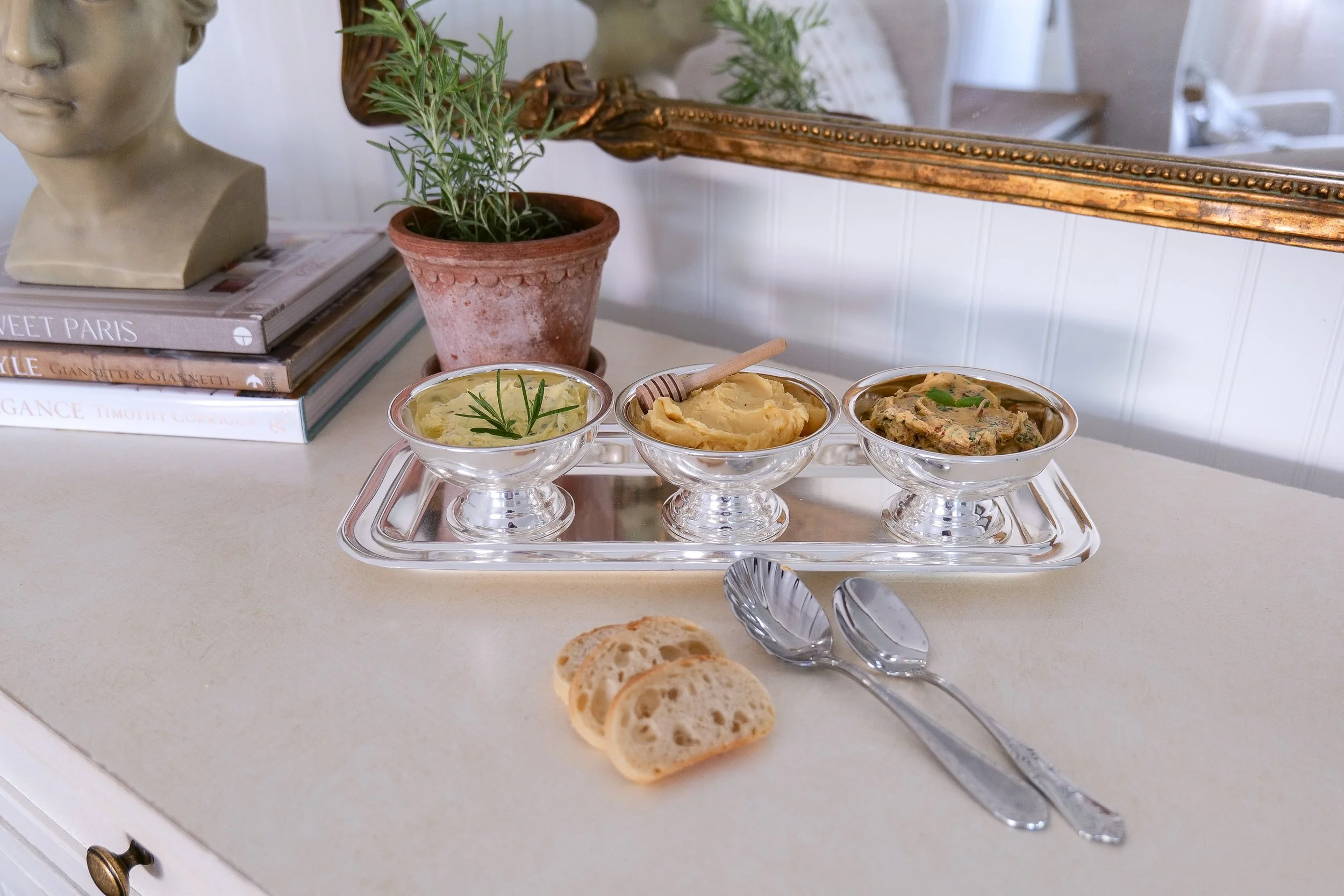 Three types of compound butter presented in a metal cup