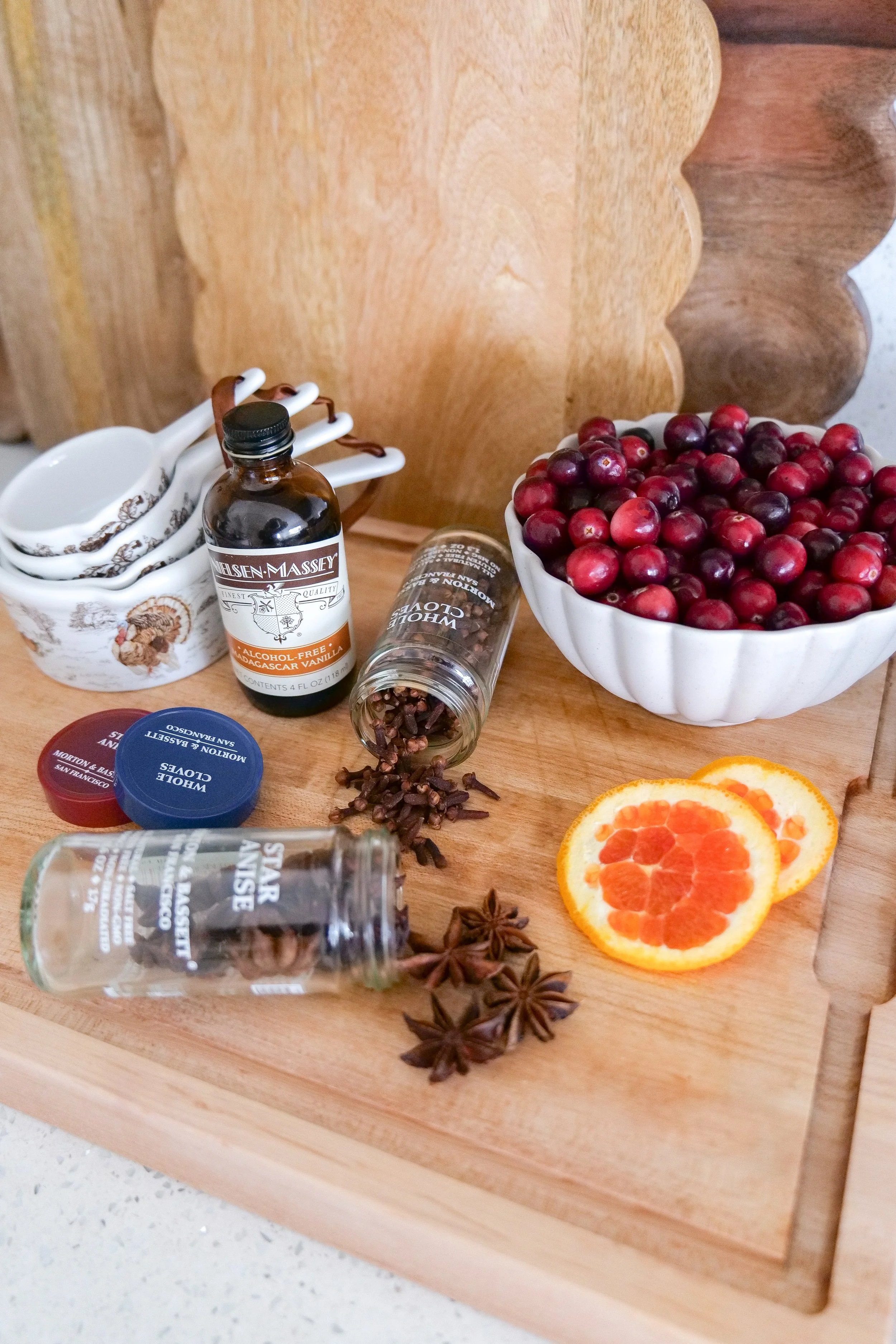 Fresh fruit, cinnamon sticks, star anise, cloves, and rosemary for homemade fall simmer pot