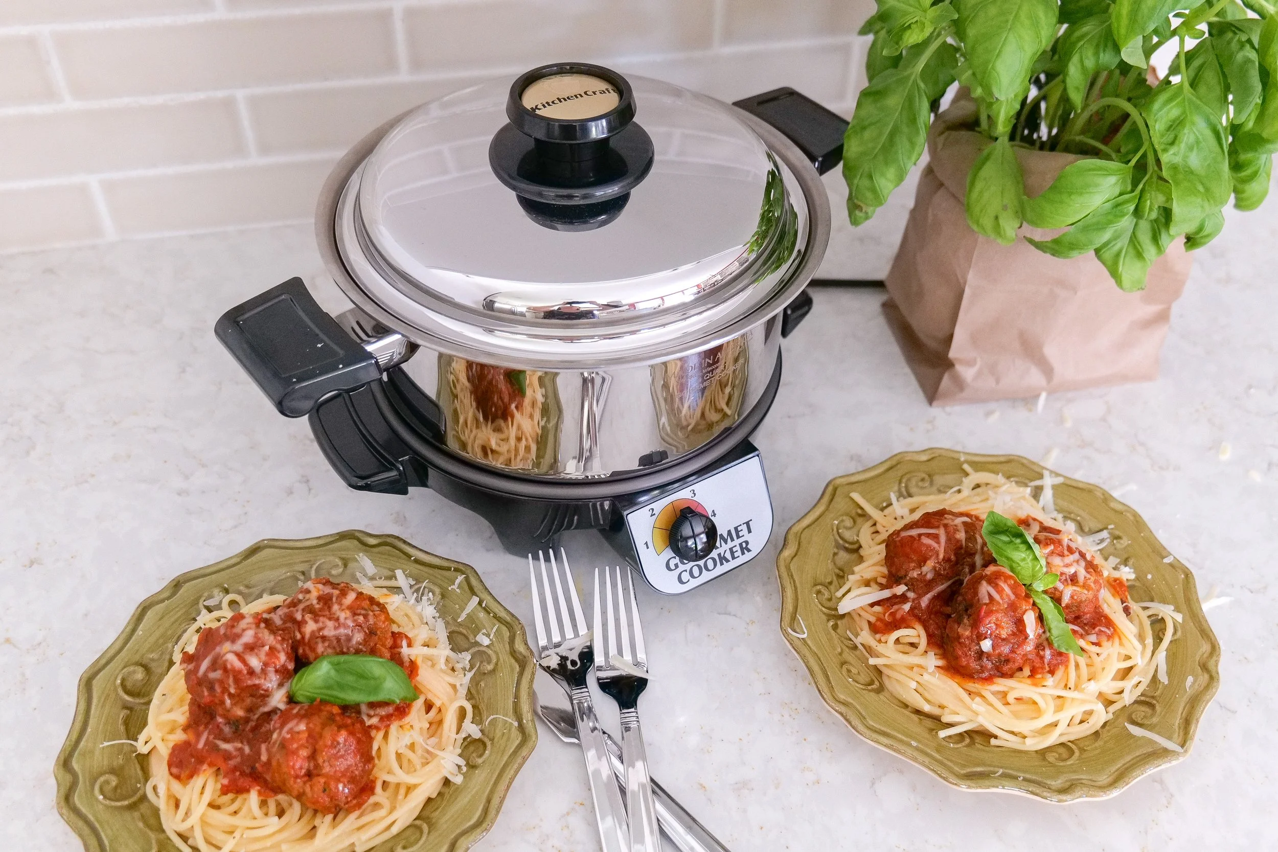 Slow cooker comfort food meatballs served with marinara sauce and herbs