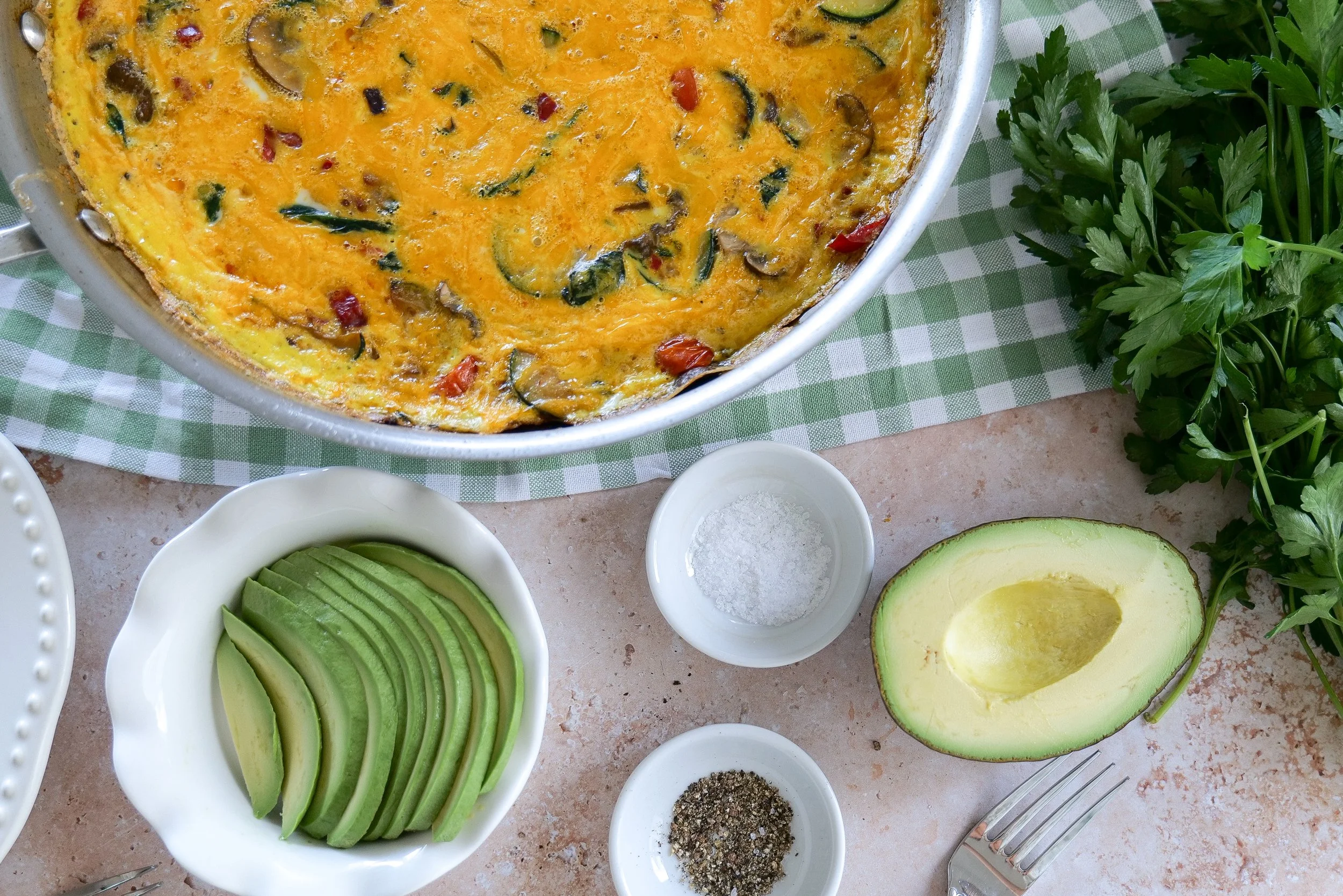 Easy summer veggie frittata recipe made with zucchini tomatoes spinach and fresh herbs