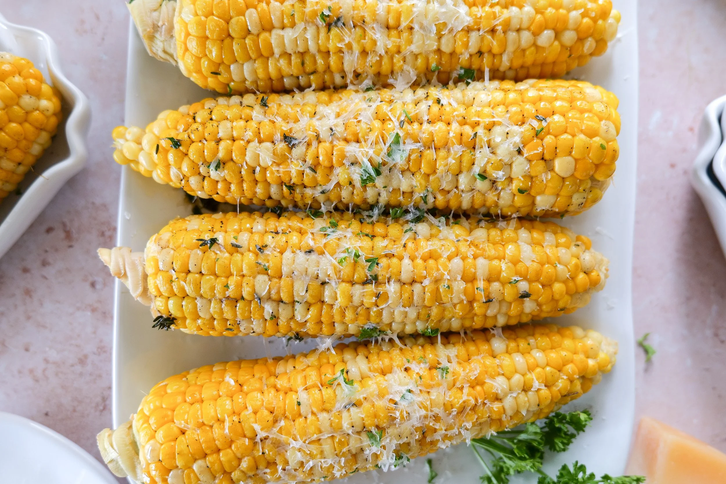 Americana-inspired tablescape featuring fresh corn on the cob