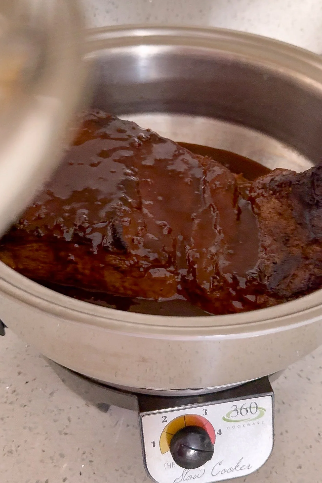 Shredded slow cooker brisket tossed with just enough BBQ cooking juices to stay moist.