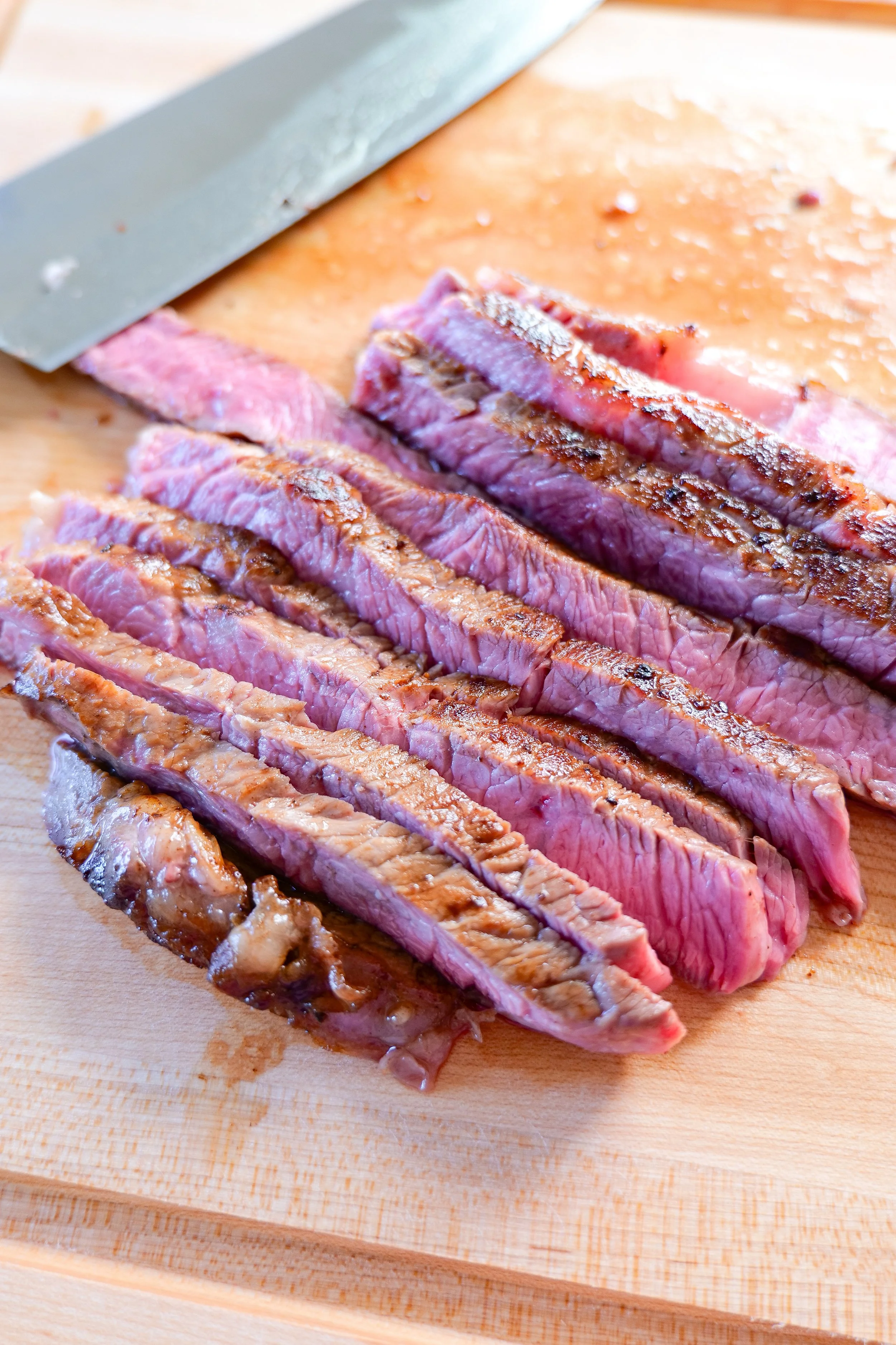 Thinly sliced rested ribeye steak
