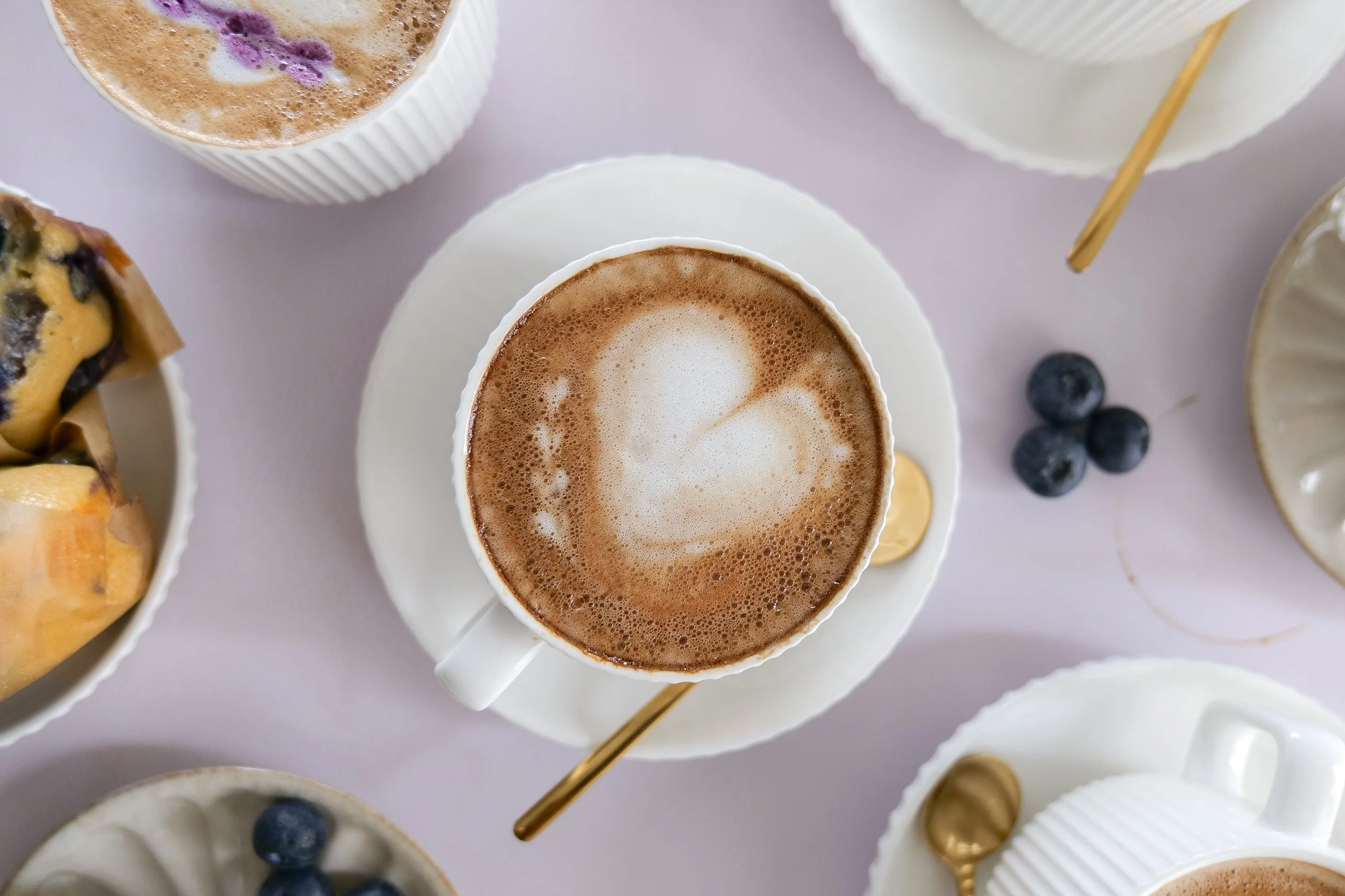 Bakery-style Blueberry Muffin Latte with creamy foam and homemade blueberry syrup.