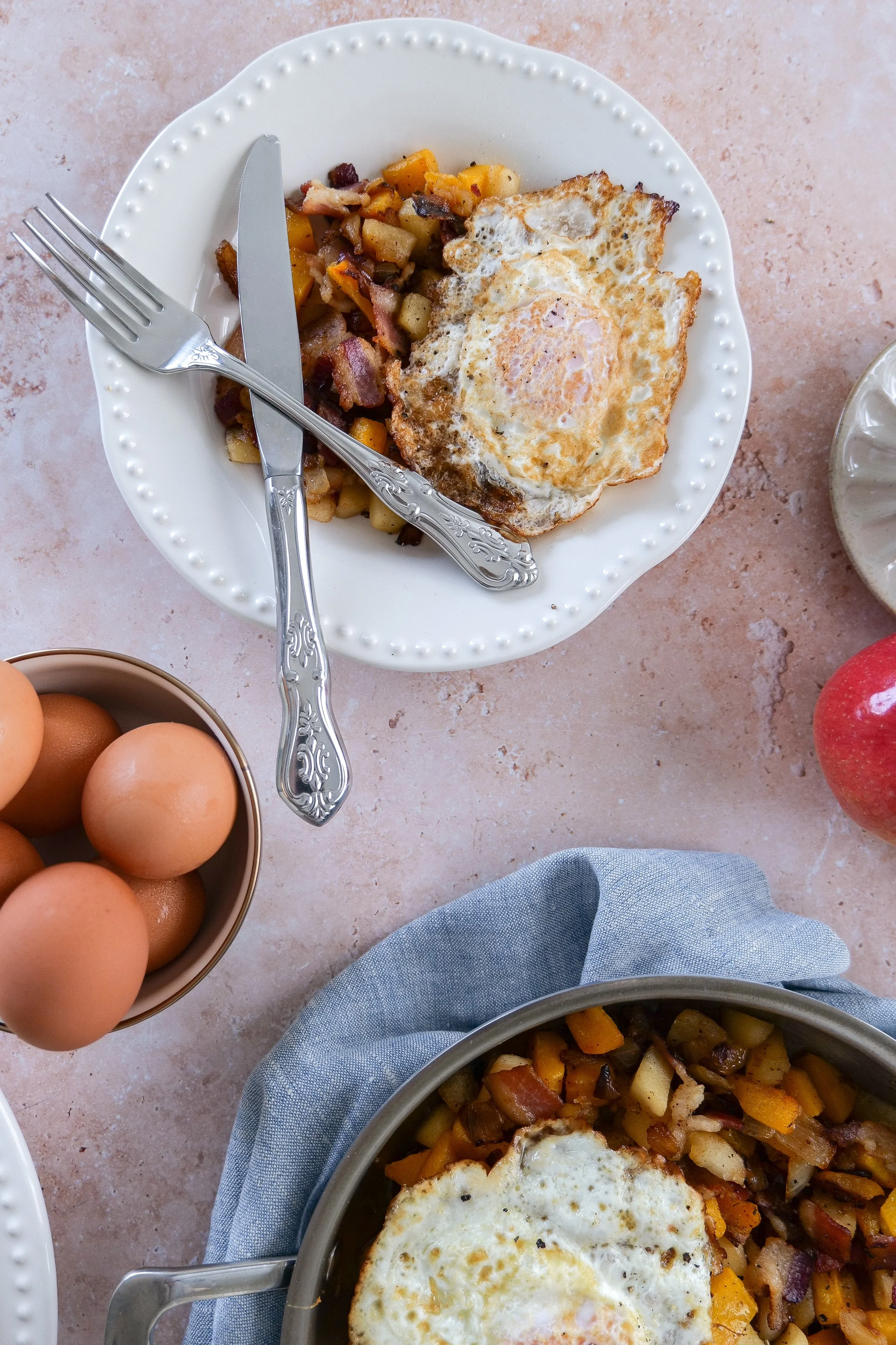 Apple and butternut squash hash with savory bacon and caramelized onions.