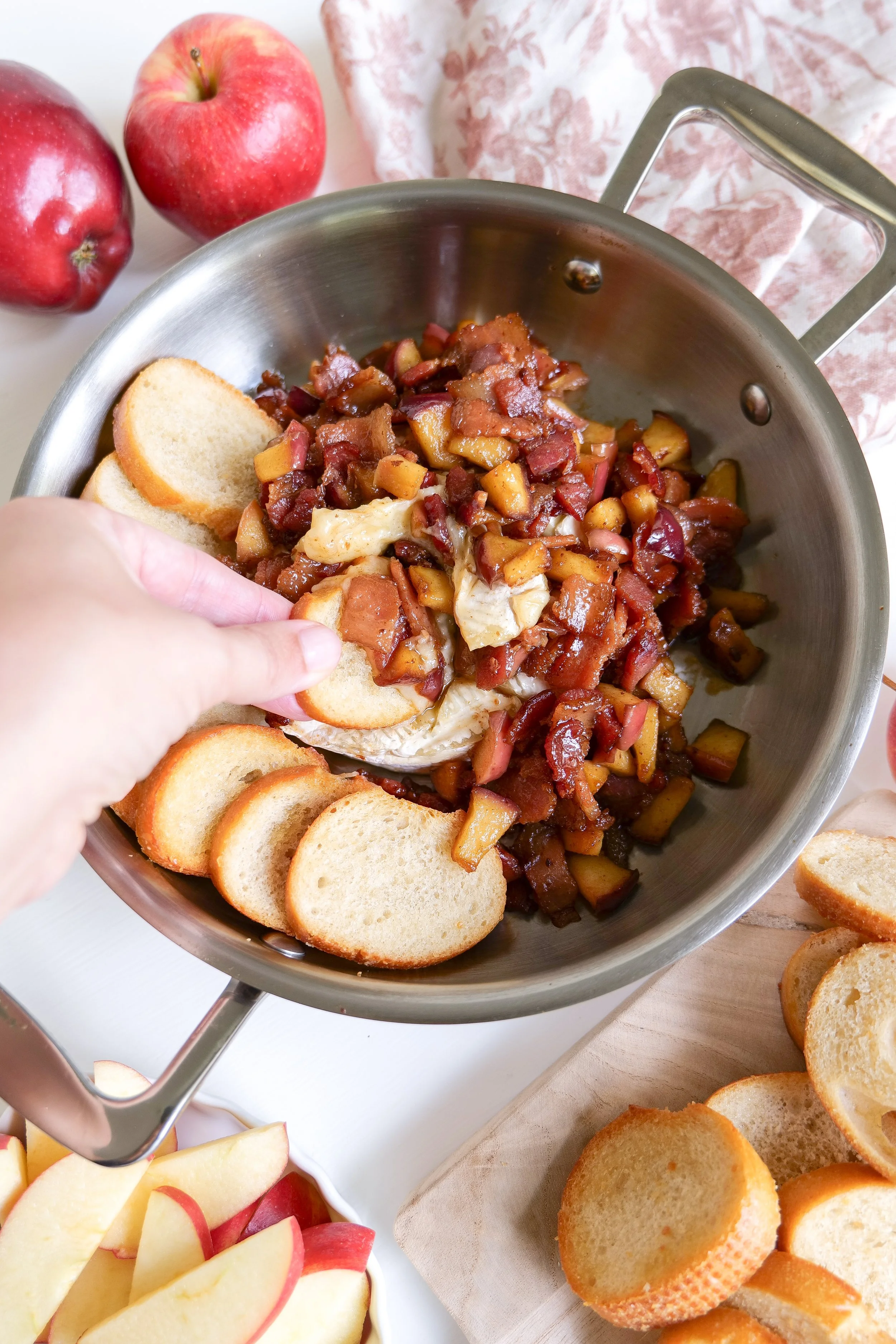 Creamy cheese pull from warm baked brie topped with crispy bacon and caramelized apples.