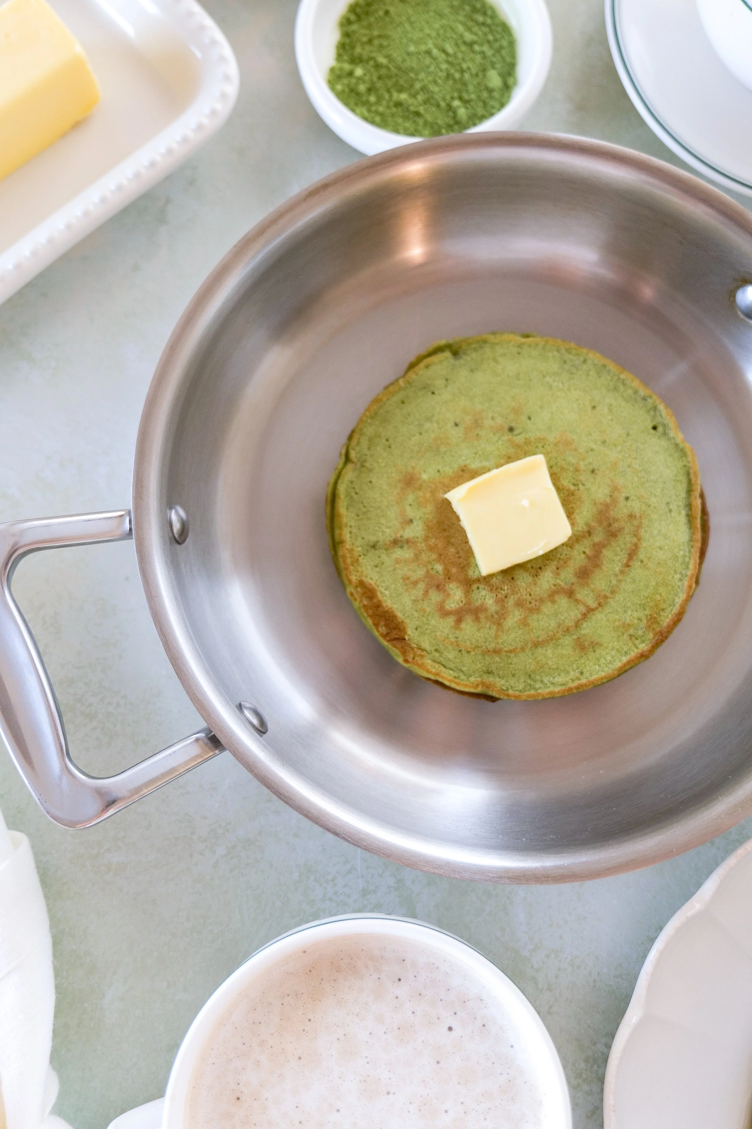 Matcha sourdough discard pancakes served with butter