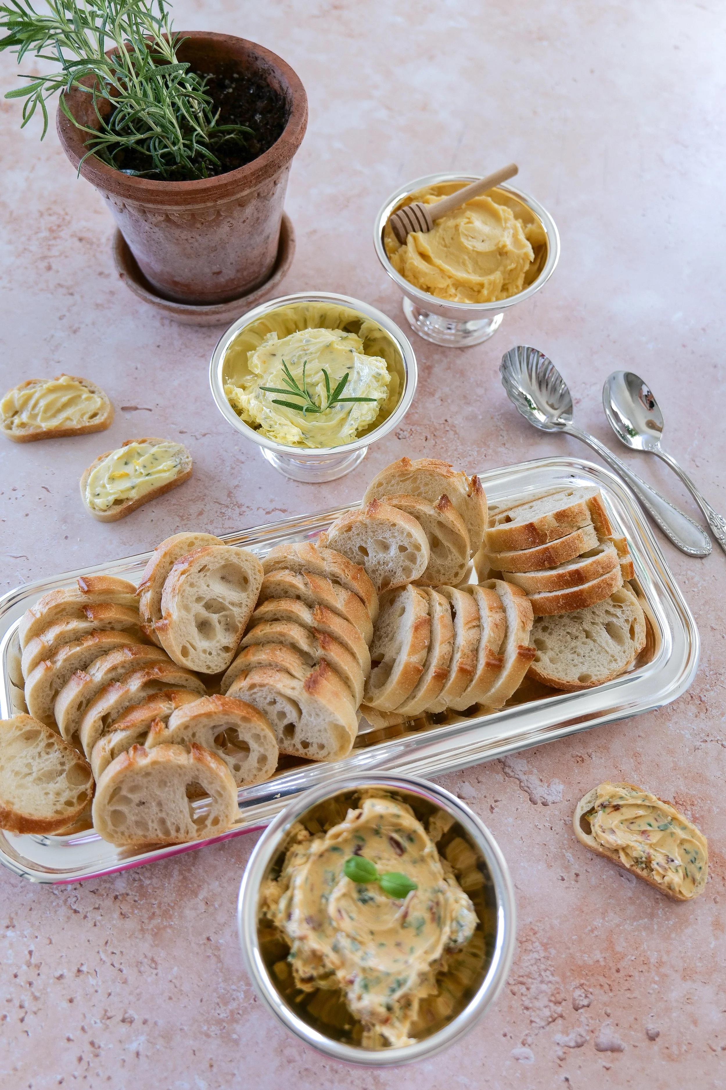 Three types of compound butter with crispy toasted baguette slices