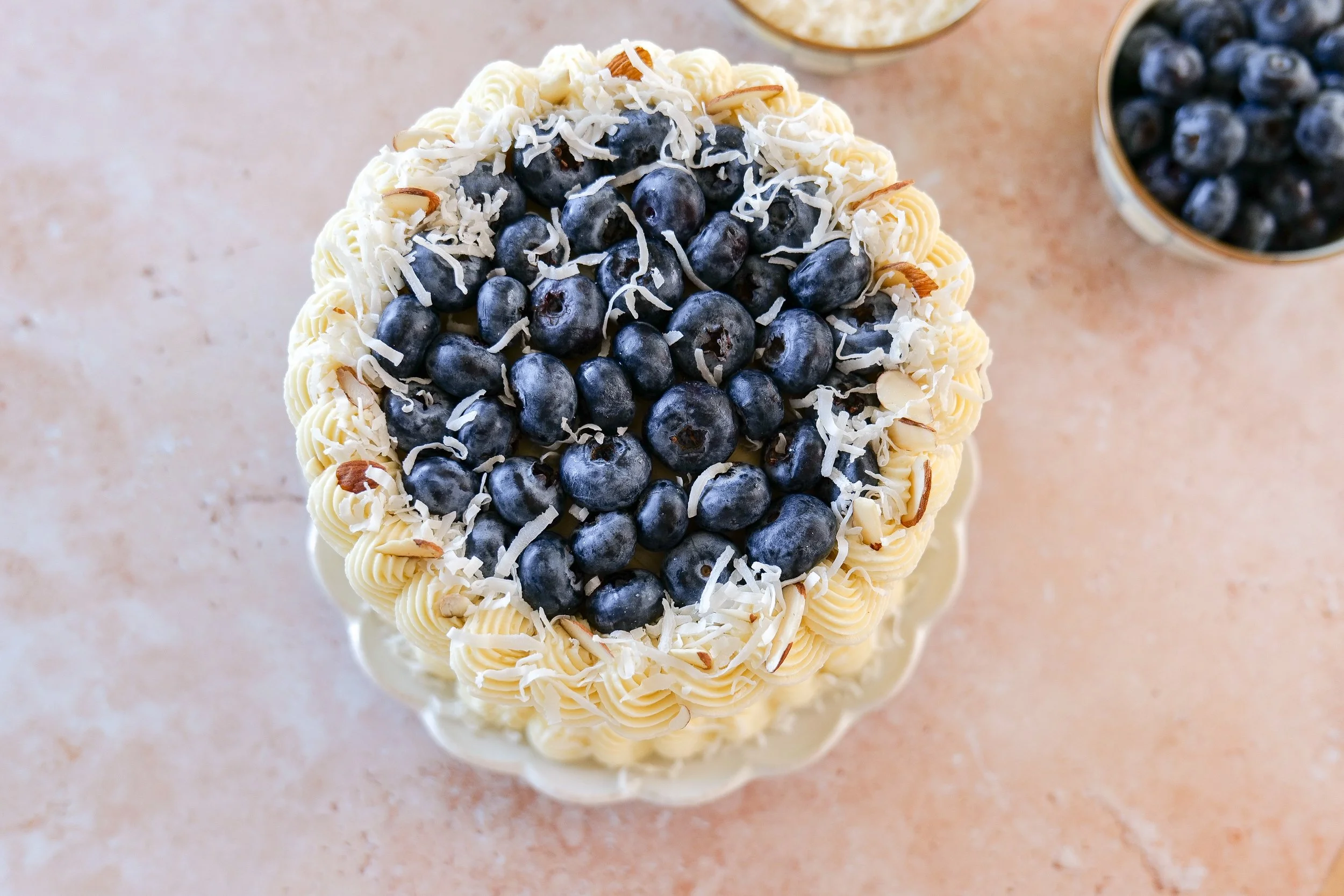 Elegant spring celebration cake with blueberry curd filling.