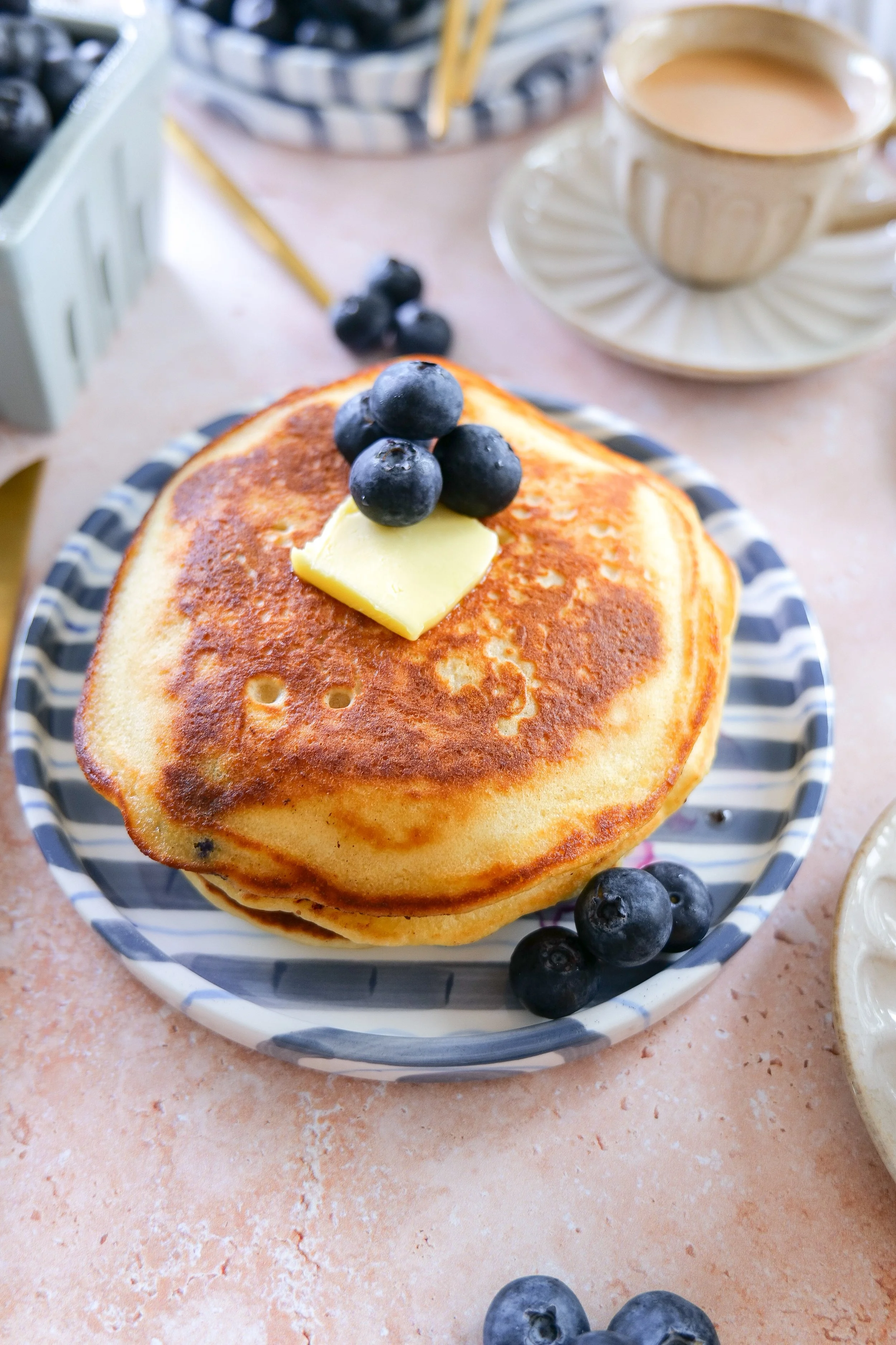 Blueberry brunch pancakes with fluffy texture and fresh summer berries.