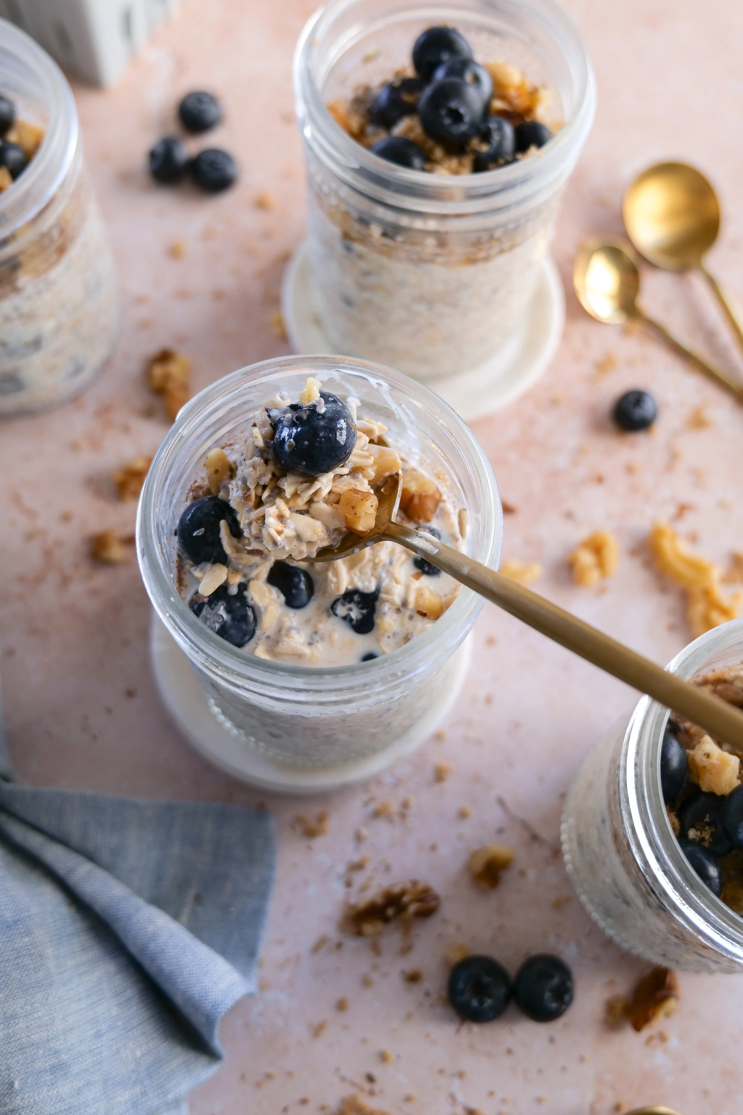 Meal prep jars filled with Blueberry Pie Overnight Oats for an easy breakfast.