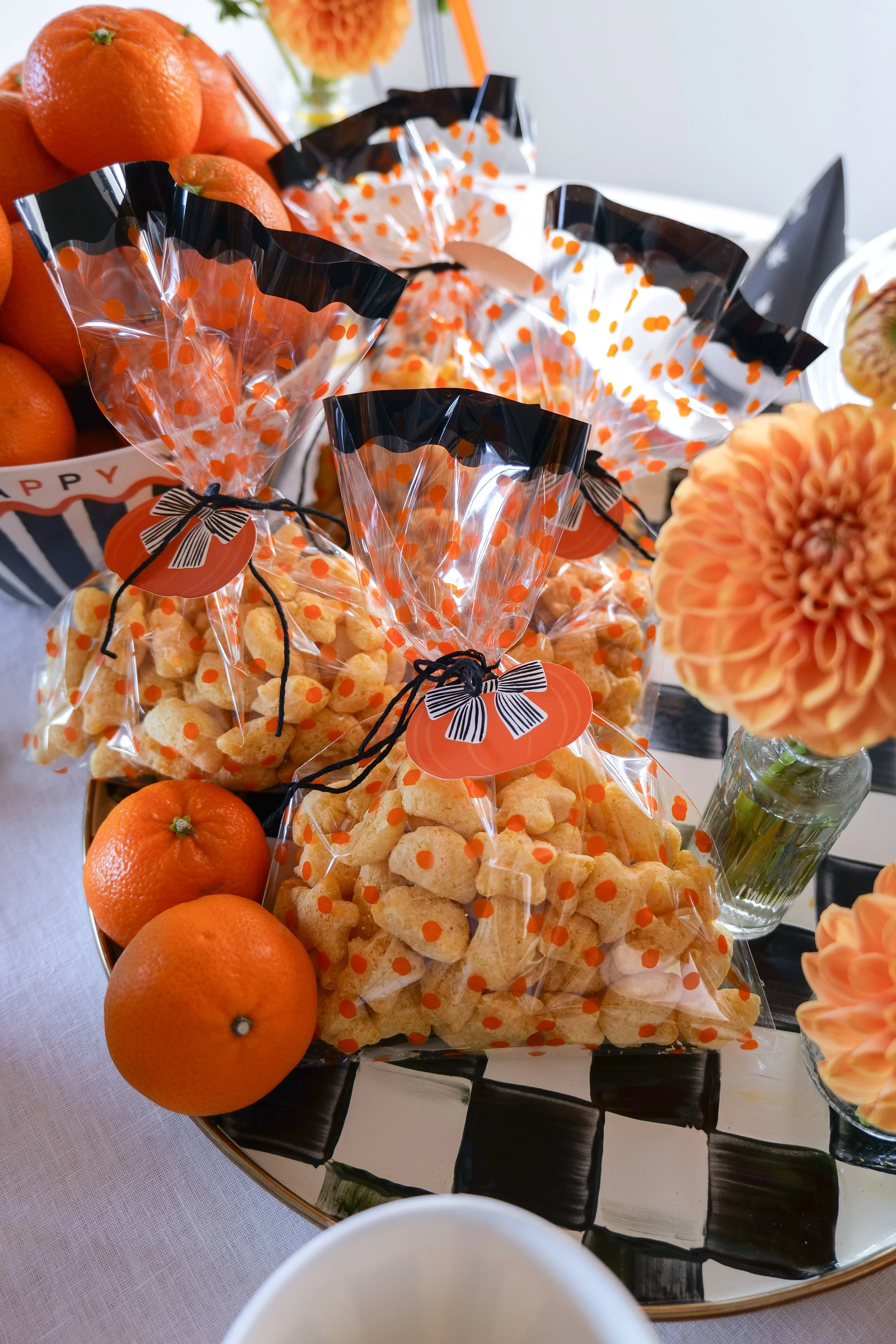Halloween goodie bags filled with Little Spoon Puffs for a kids breakfast table.