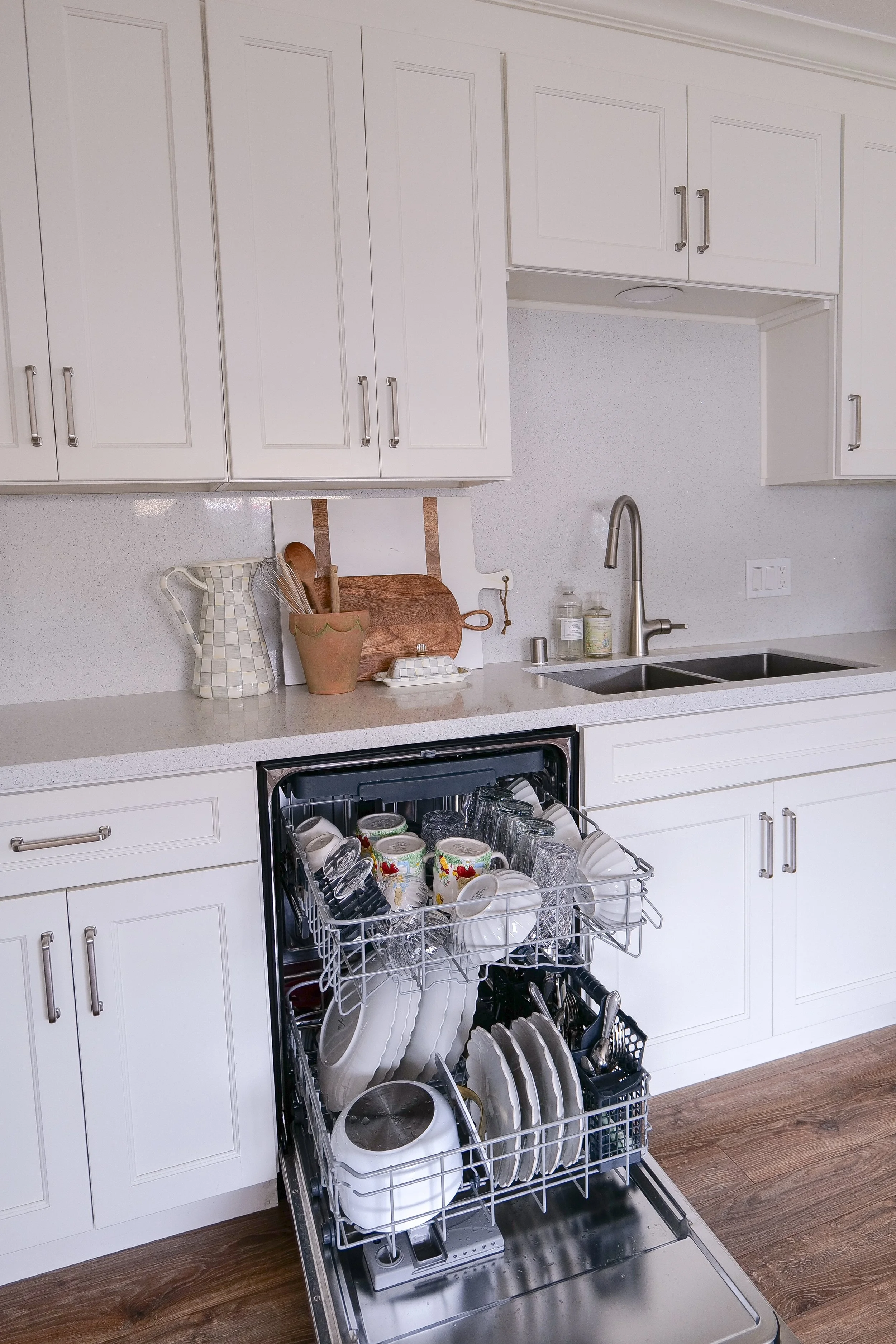 Clean stainless steel interior of Kucht dishwasher after a wash cycle.