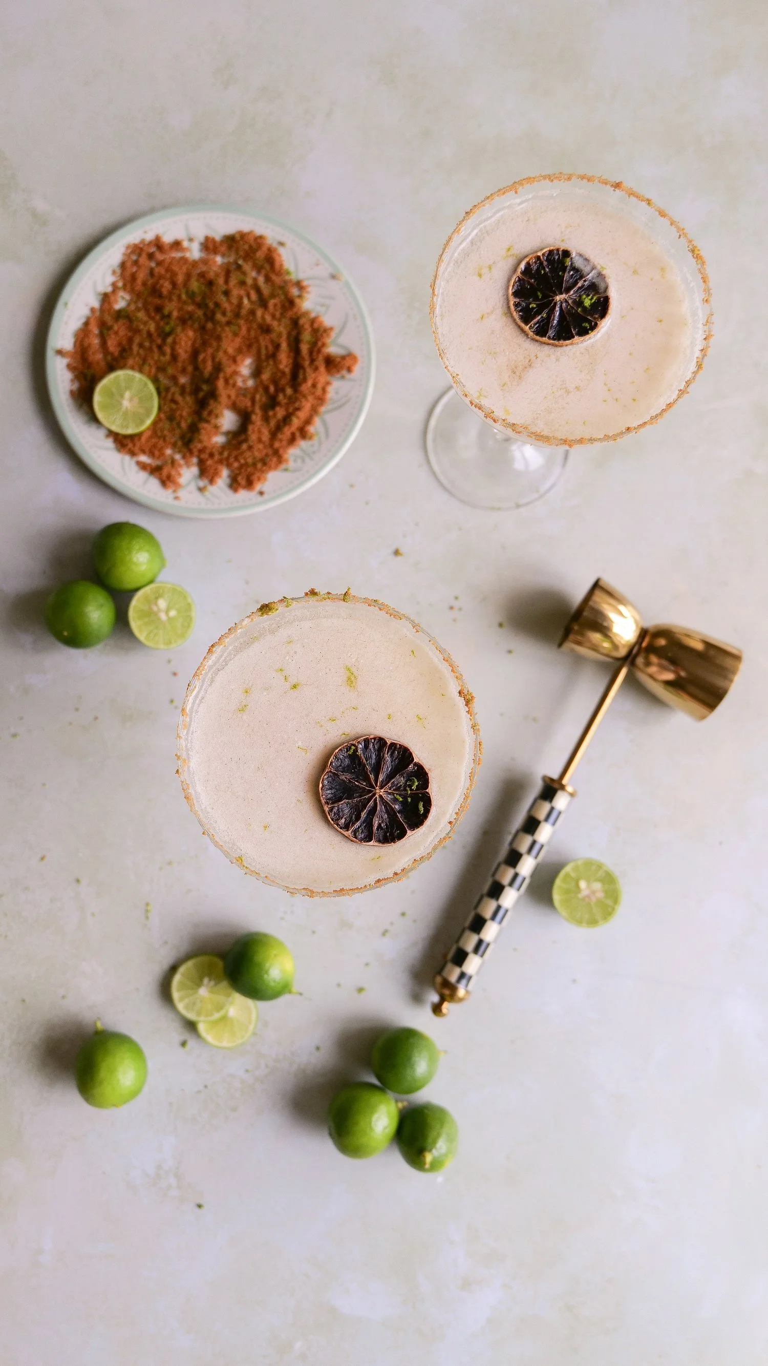 Creamy key lime martini garnished with fresh lime