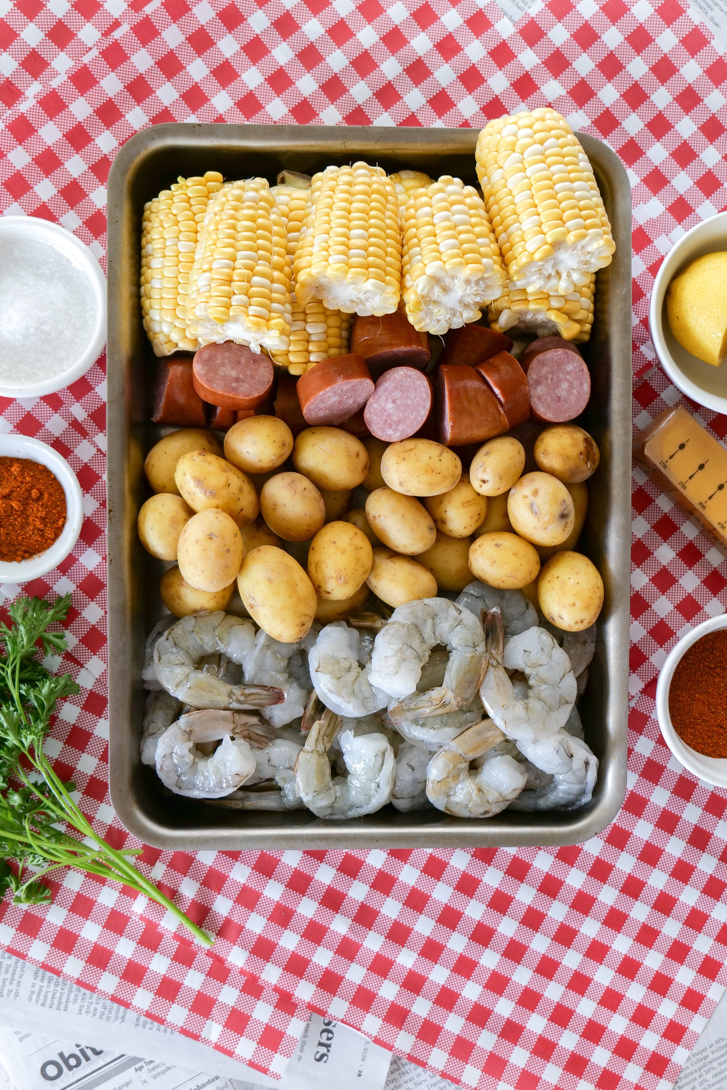 Easy shrimp boil recipe made with fresh shrimp, smoked sausage, baby potatoes, and sweet corn.