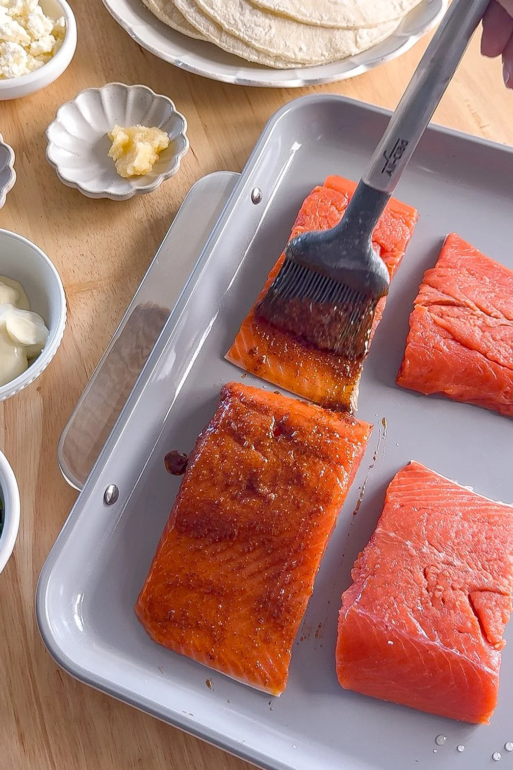 Salmon fillets seasoned with chili powder, garlic powder, paprika, and lime