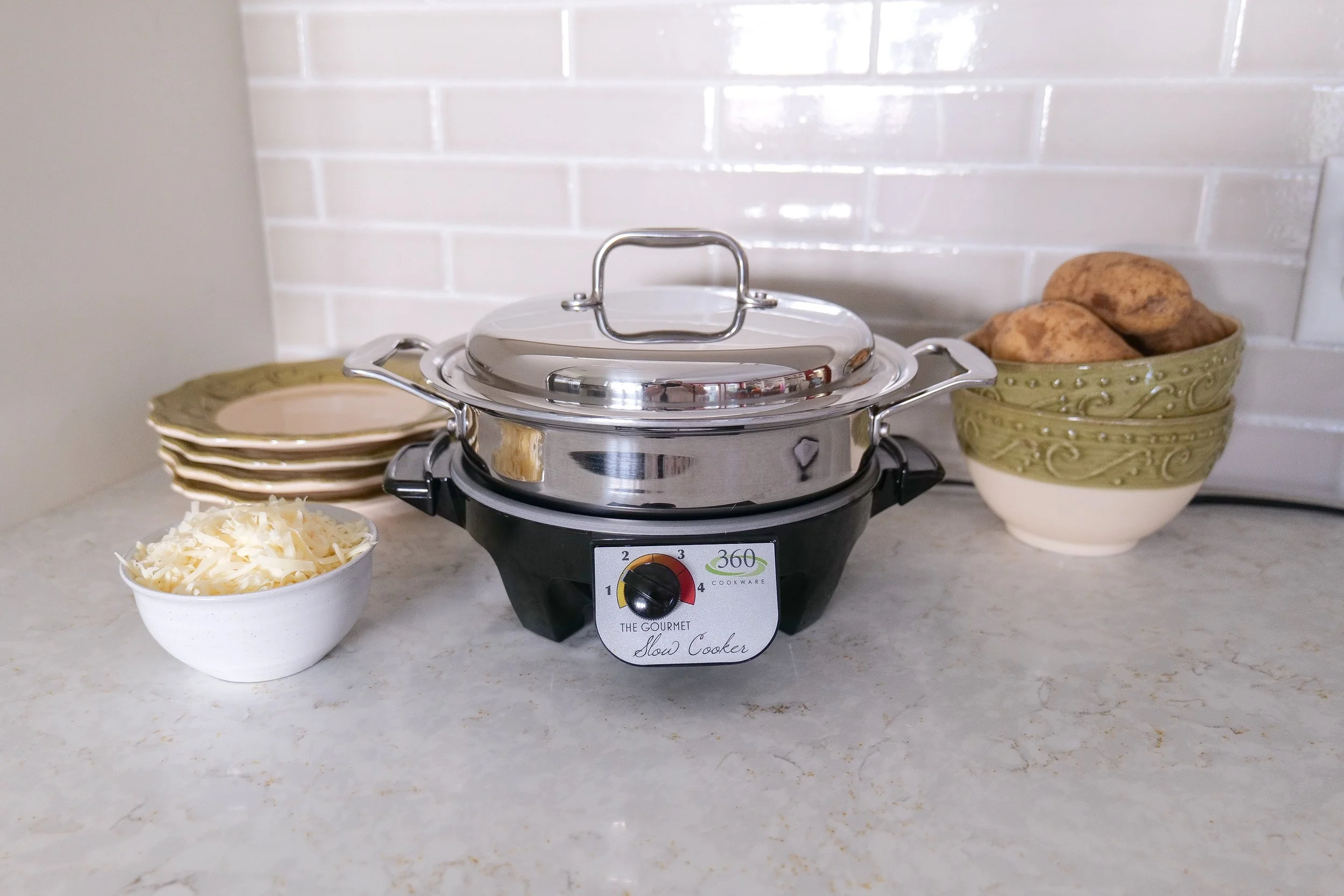 Creamy slow cooker scalloped potatoes layered with Gruyère cheese and baked until tender.