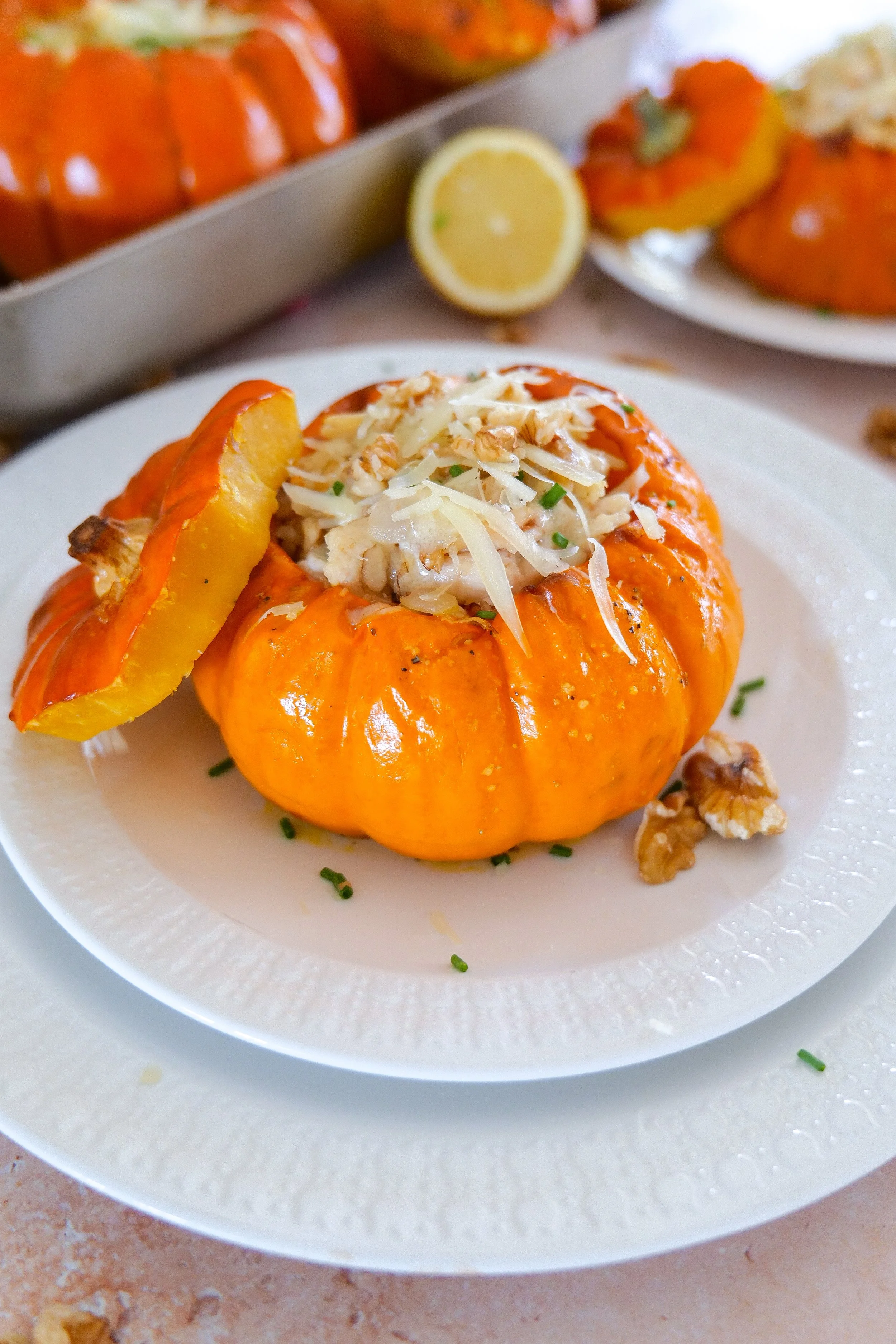 Roasted baby pumpkin used as an edible bowl for creamy chicken and walnut filling.