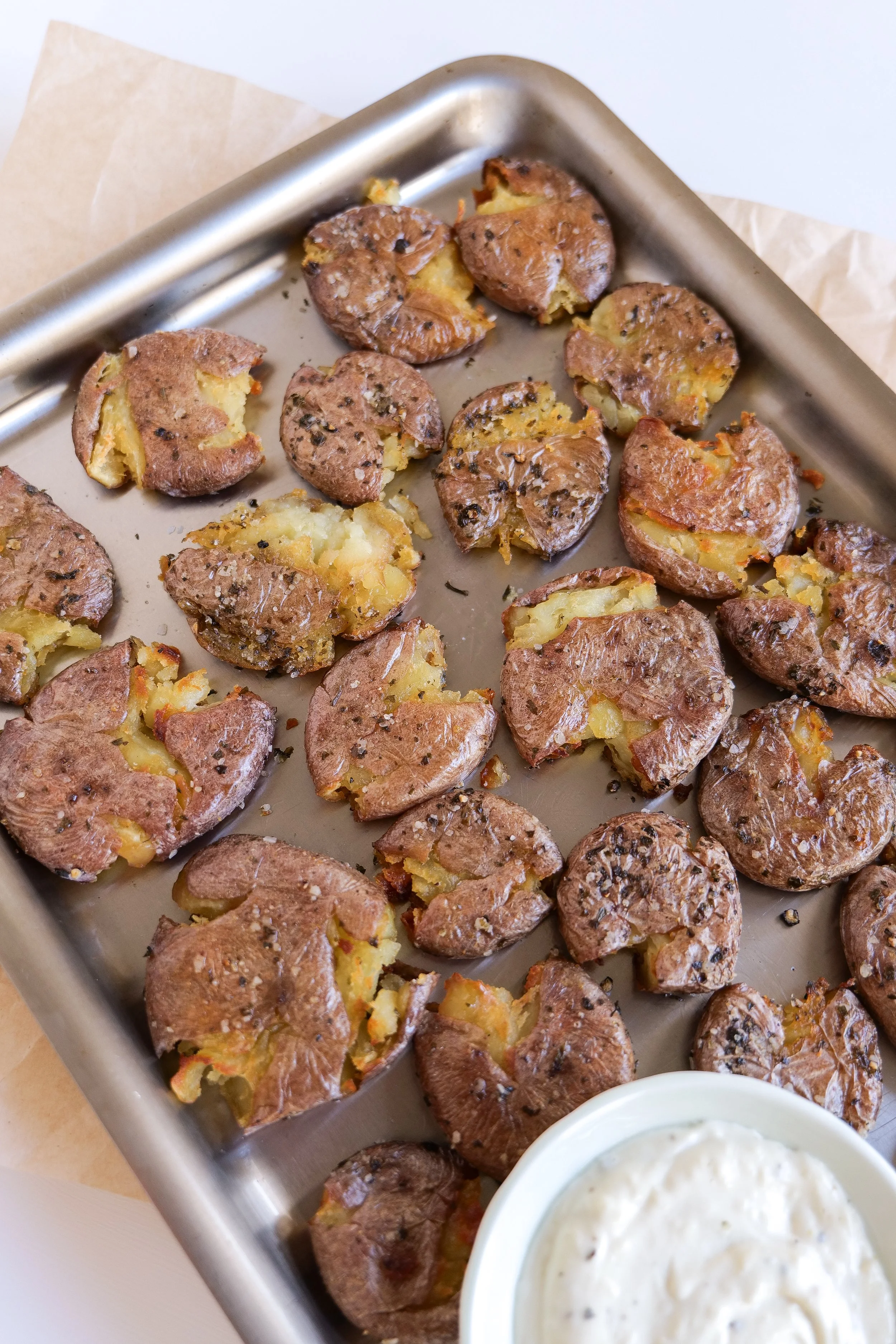 Close-up of golden crispy smashed potatoes with tender centers