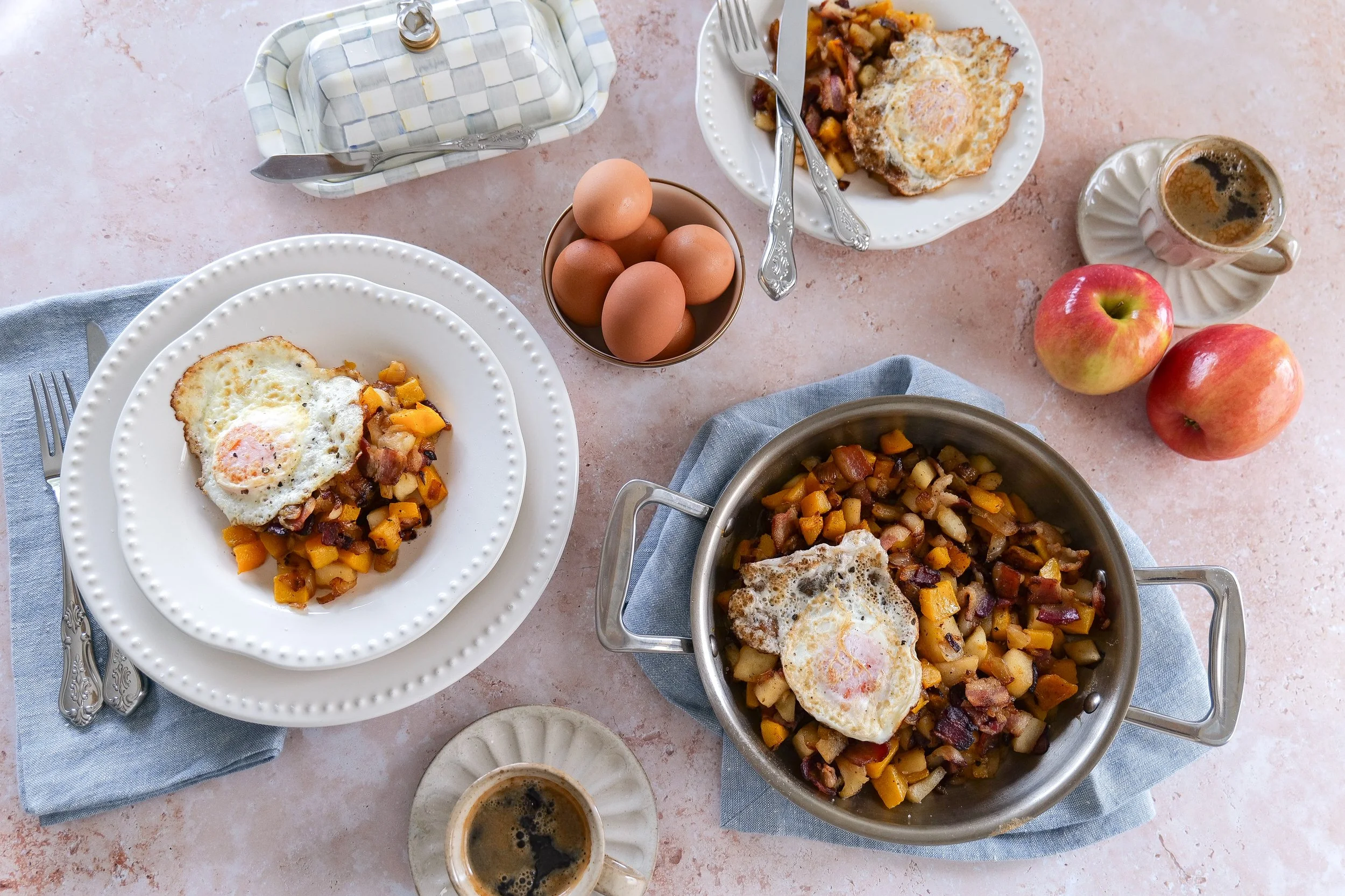 Homemade fall breakfast hash with caramelized butternut squash, apples, bacon, and eggs.