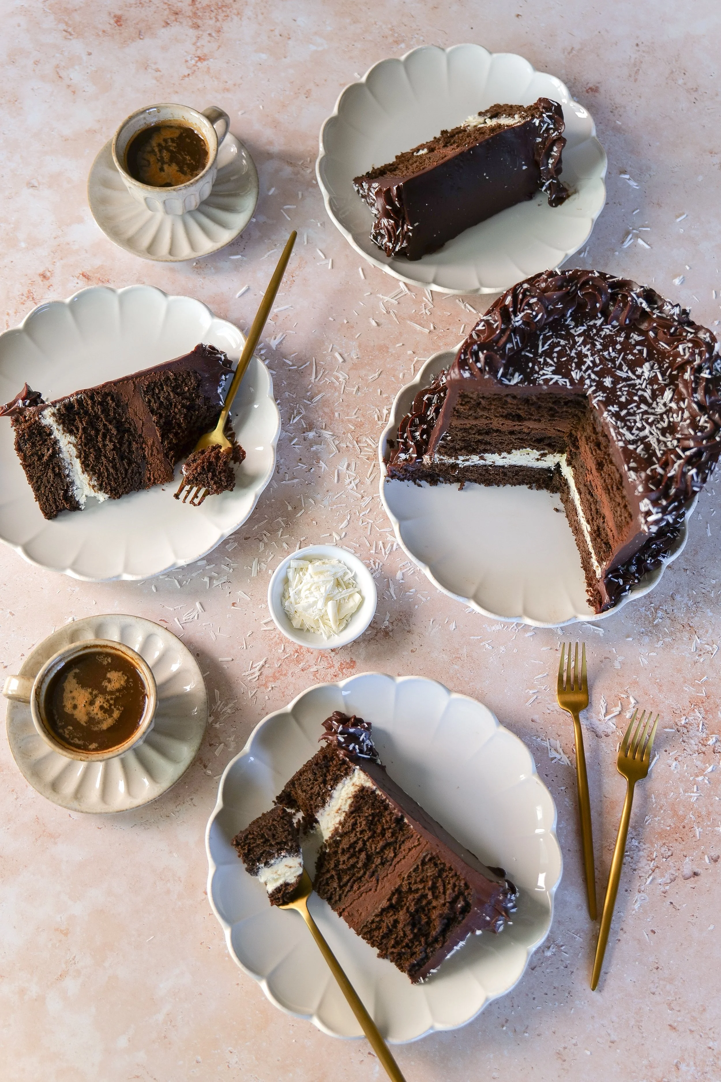 Homemade Tuxedo Cake with rich chocolate layers, chocolate mousse, white chocolate mousse, and milk chocolate ganache.