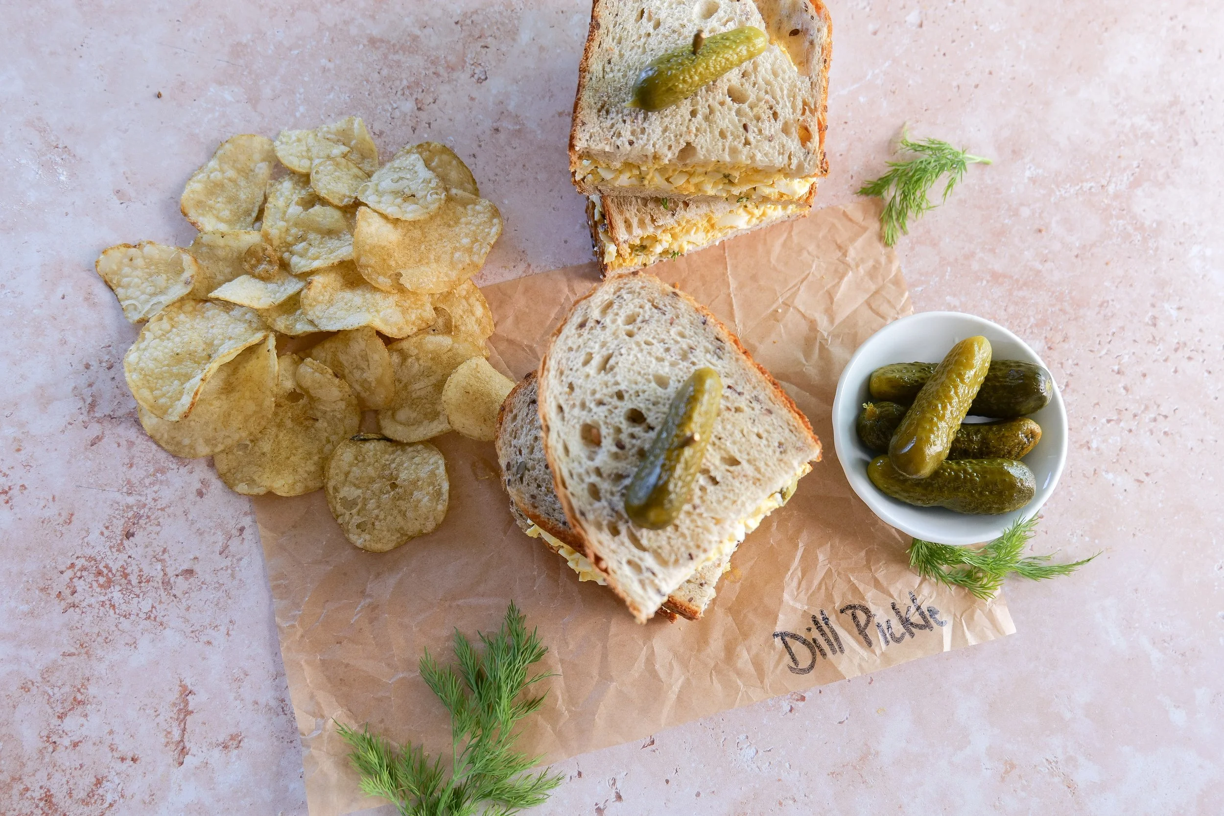 Dill pickle egg salad sandwich ready to serve for a simple homemade lunch.
