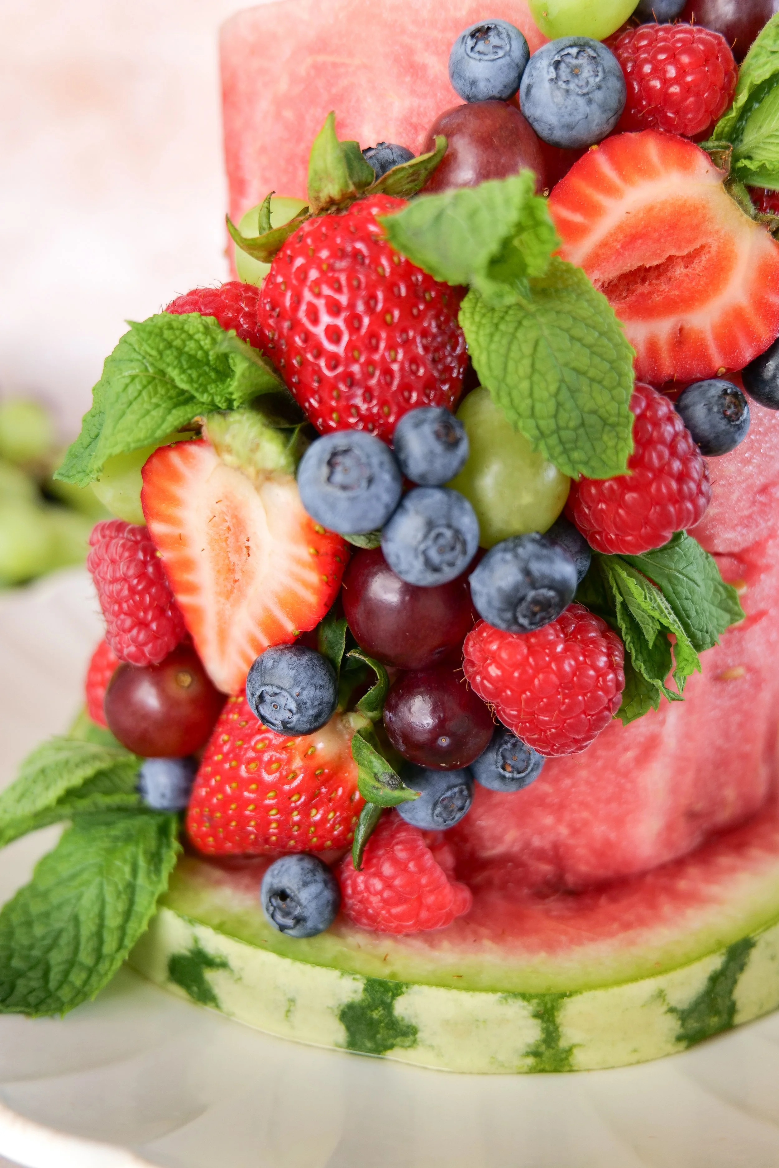 Fresh fruit watermelon cake served as a refreshing no-bake alternative to a traditional summer birthday cake.