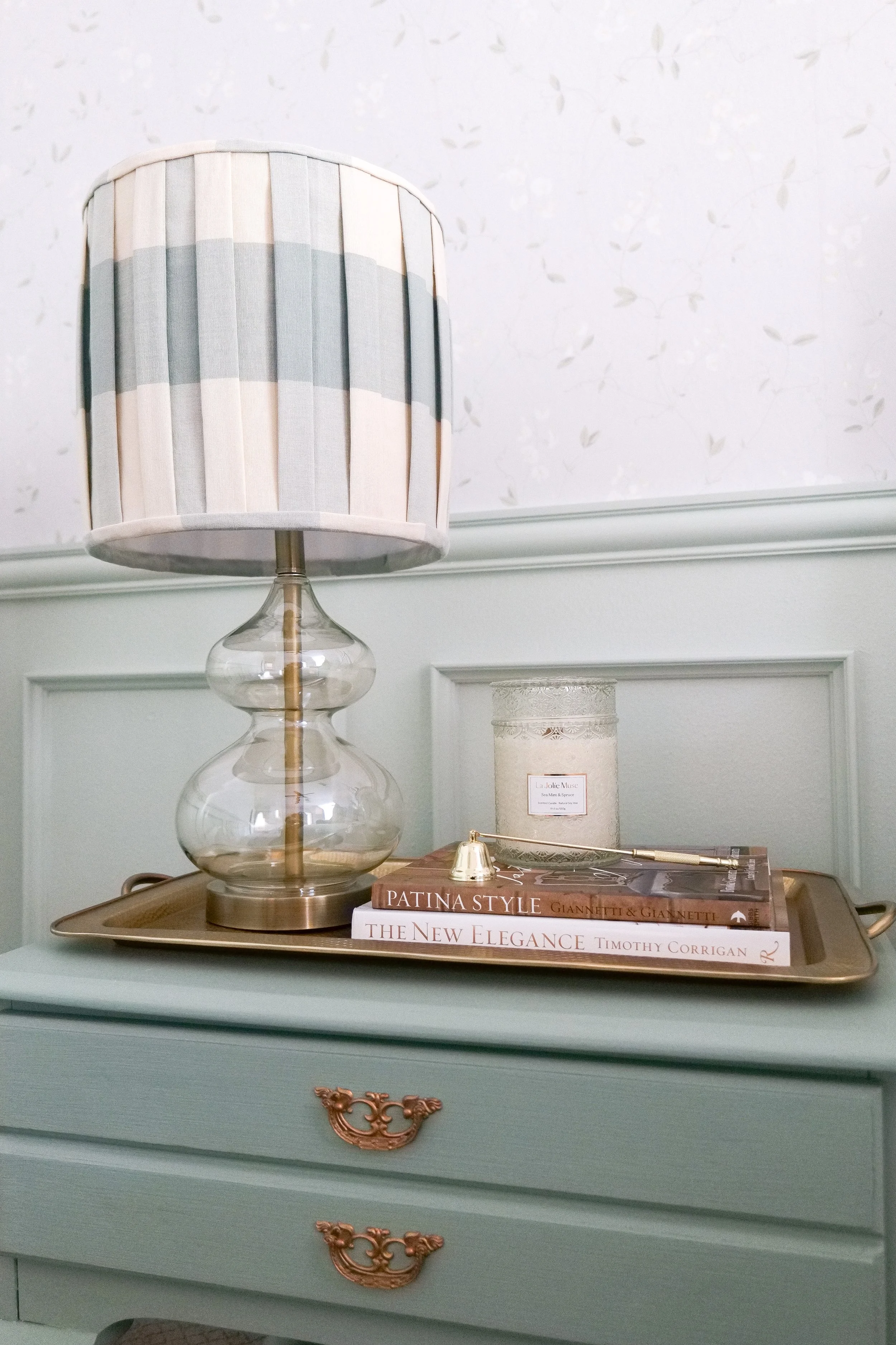 Close-up of textures in traditional blue guest bedroom including linen and woven accents.
