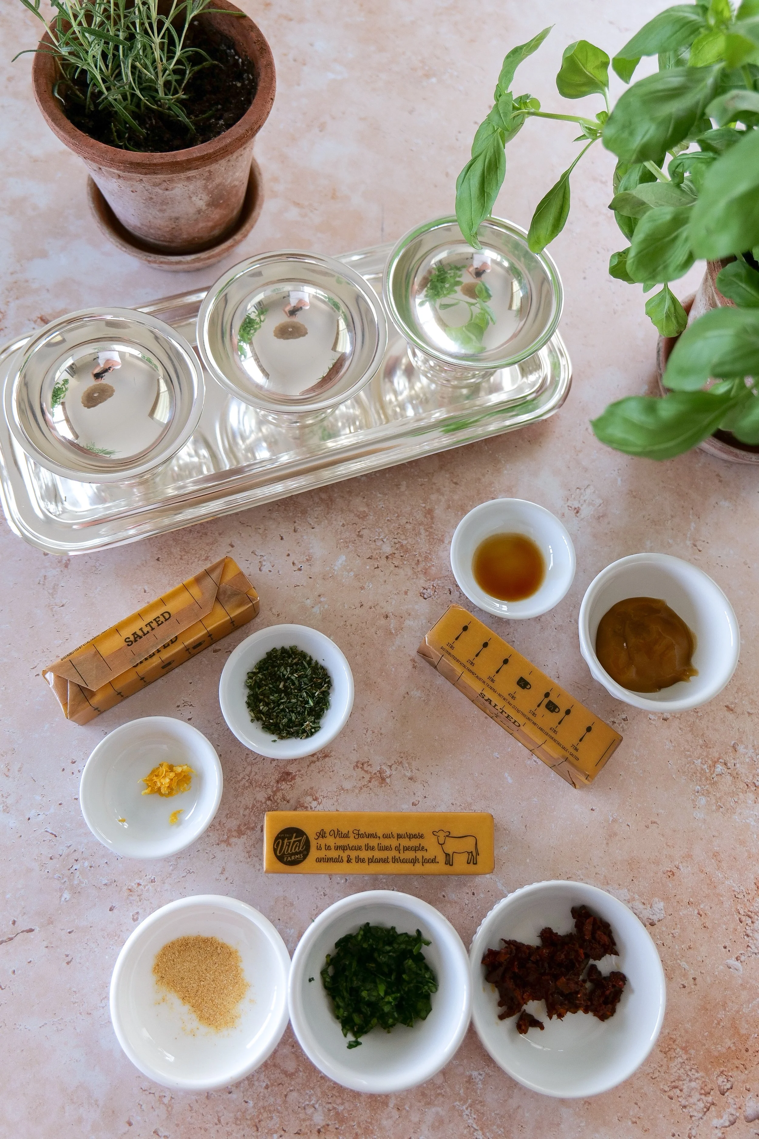 compound butter flight ingredients with Italian herb butter, lemon rosemary butter, and honey butter