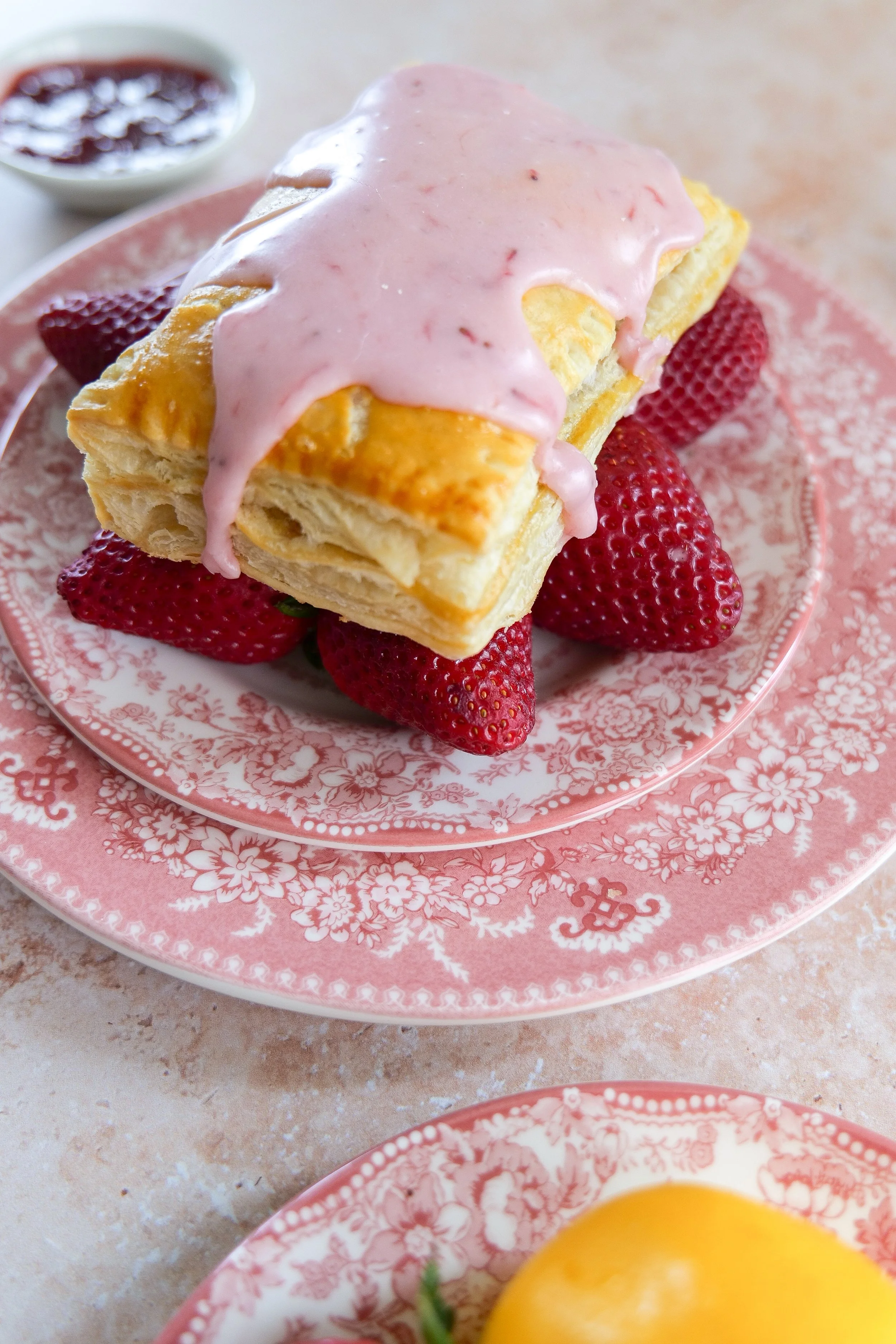 Strawberry Puff Pastry Pop Tart with golden crust and glaze