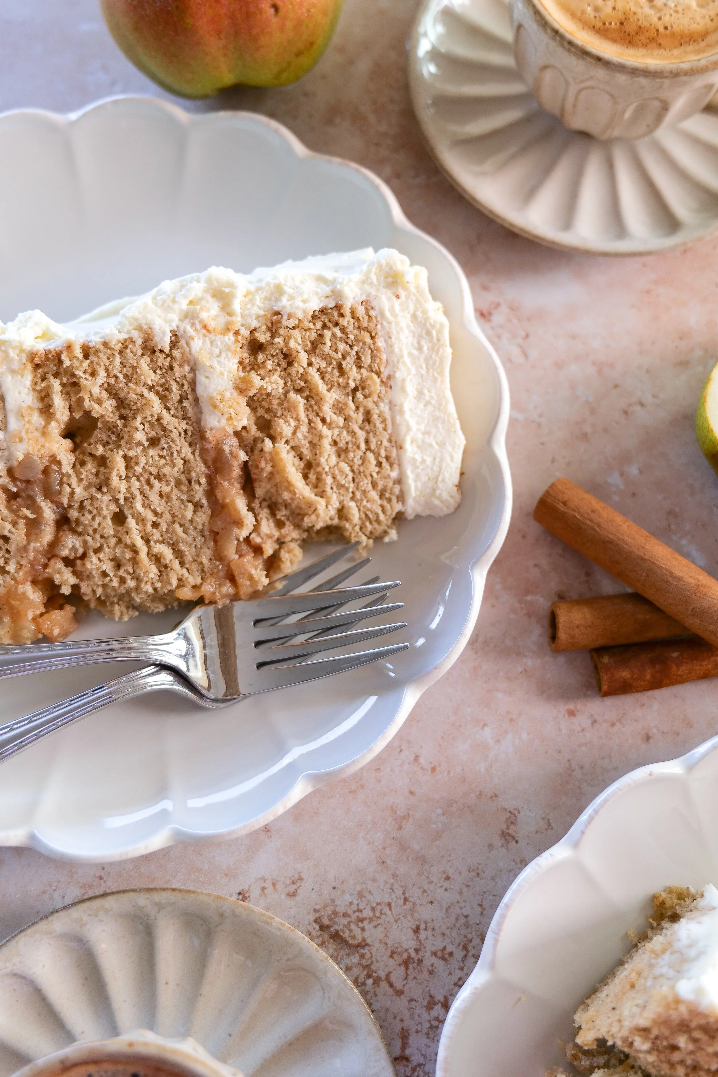 Pear mascarpone layer cake with brown butter cake layers and fresh pears on top.