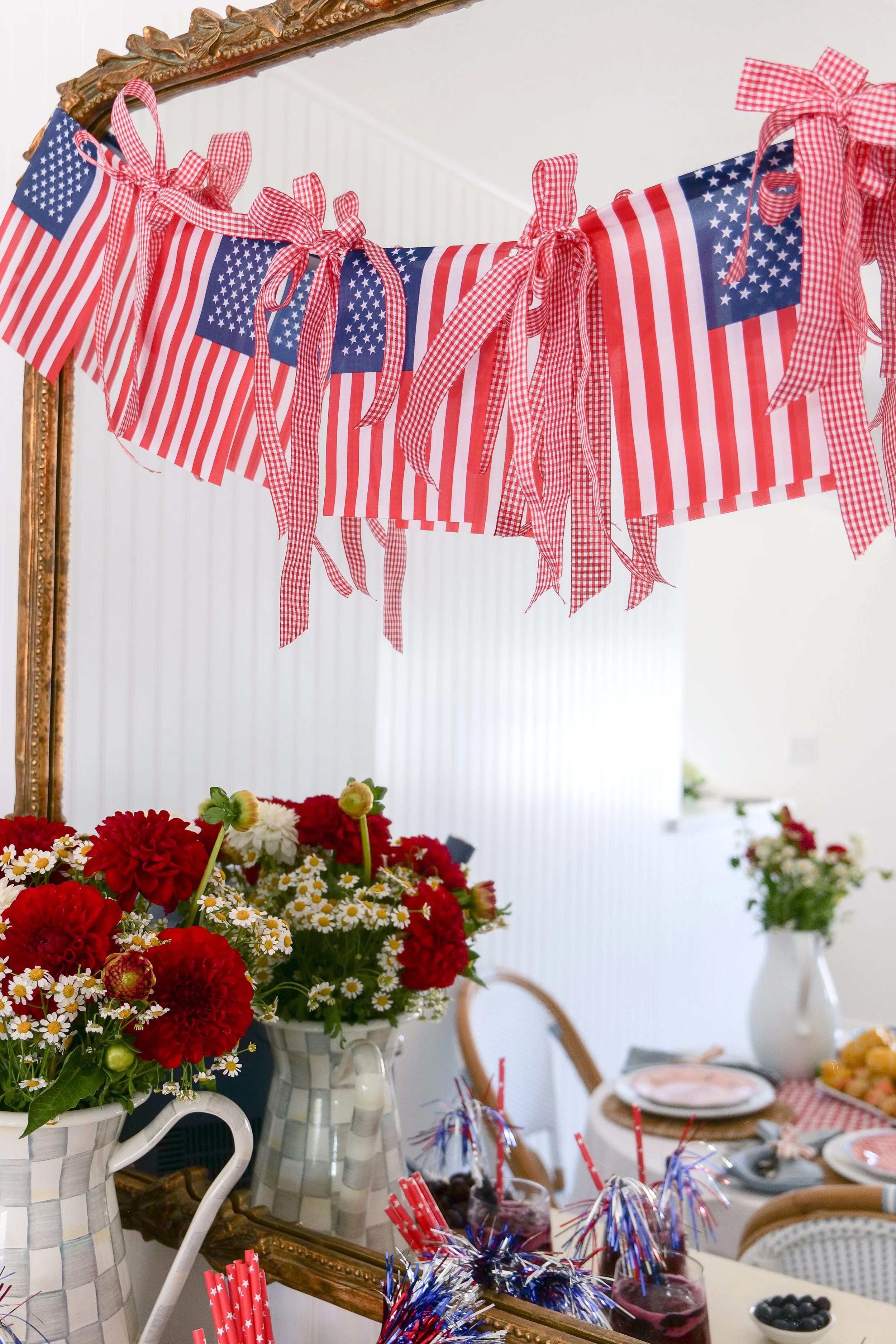 All-American summer tablescape featuring seafood, fresh flowers, and patriotic decor.