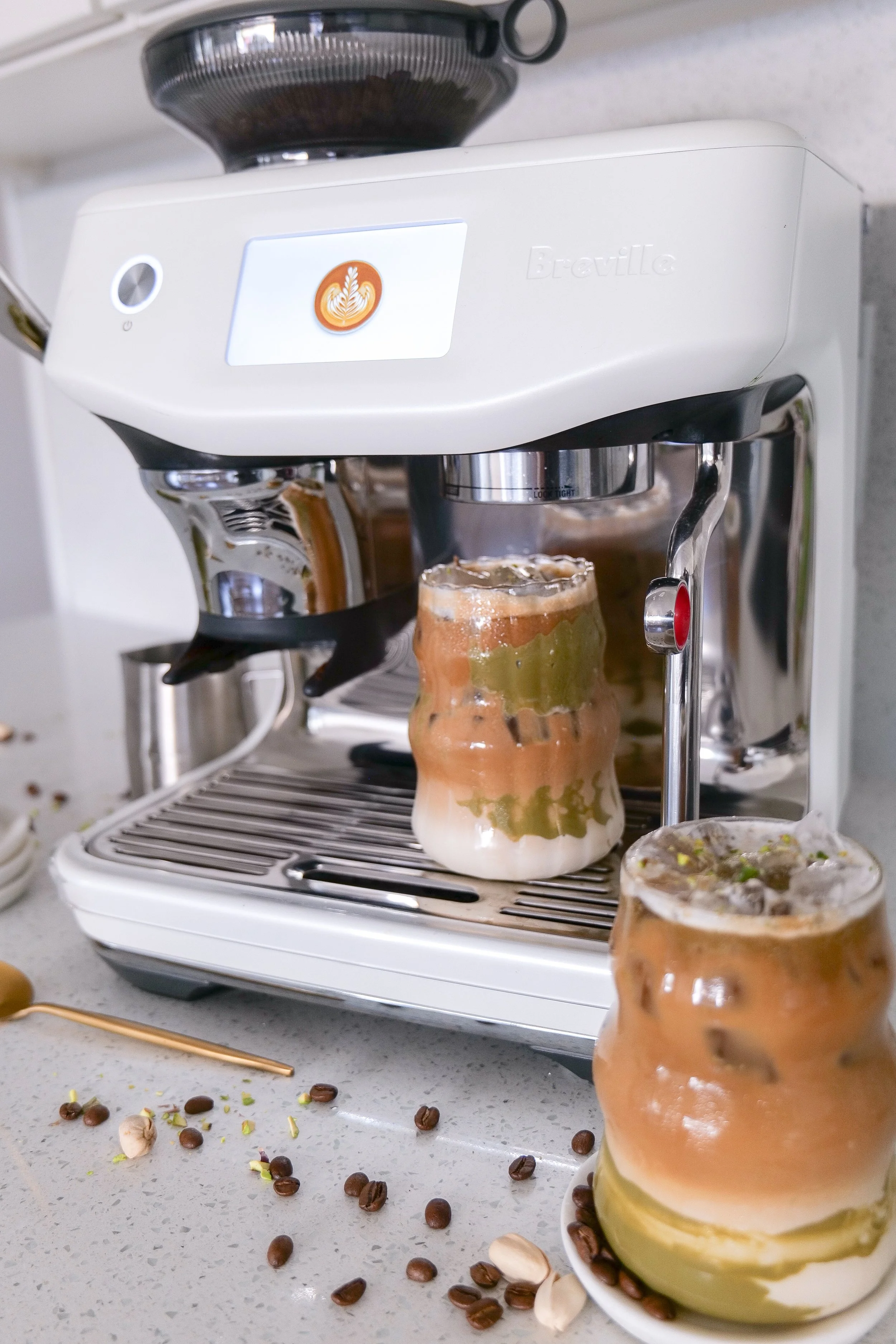 Easy homemade pistachio coffee served cold over ice for a refreshing latte.