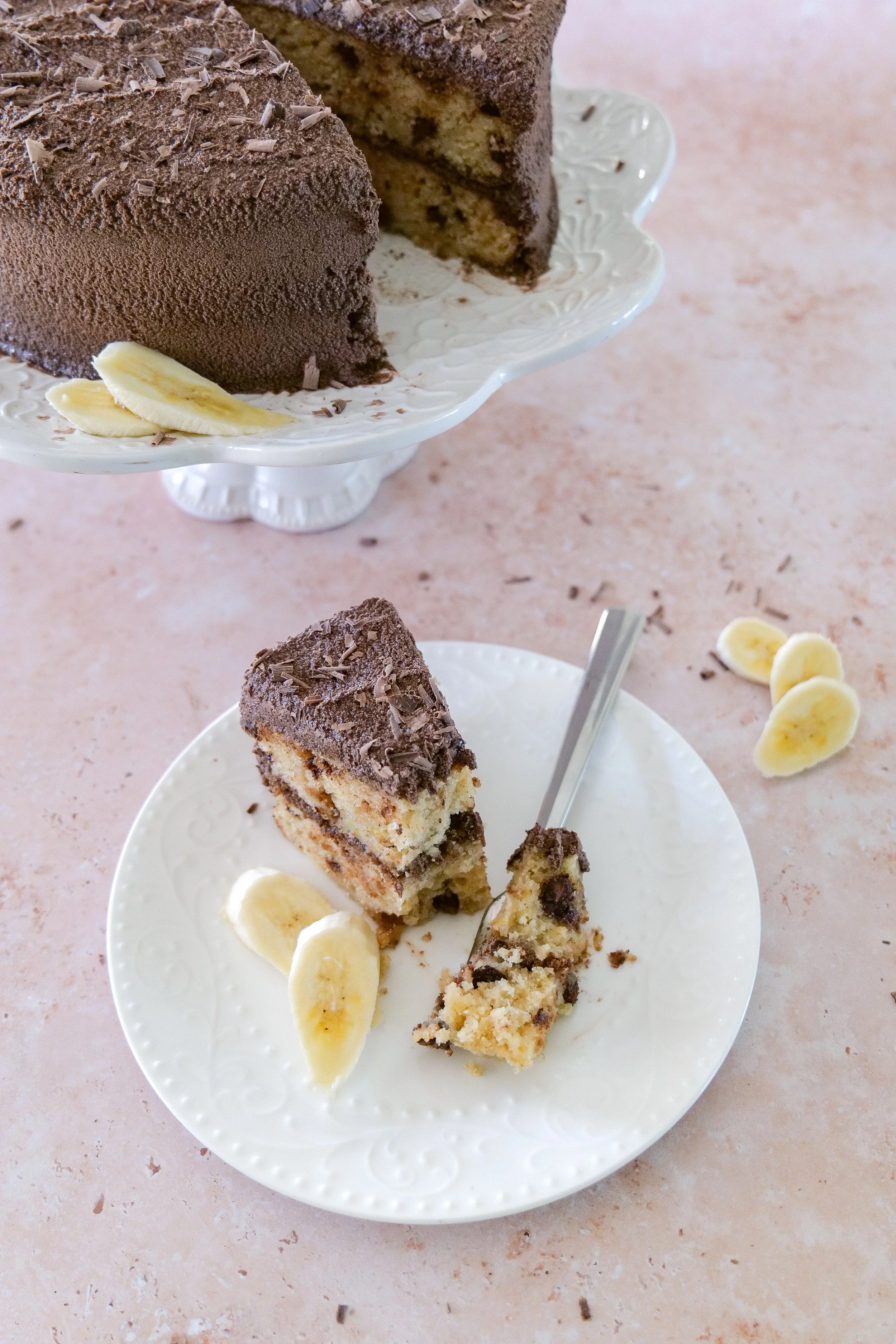 Brown butter banana chocolate chip cake with whipped chocolate frosting.