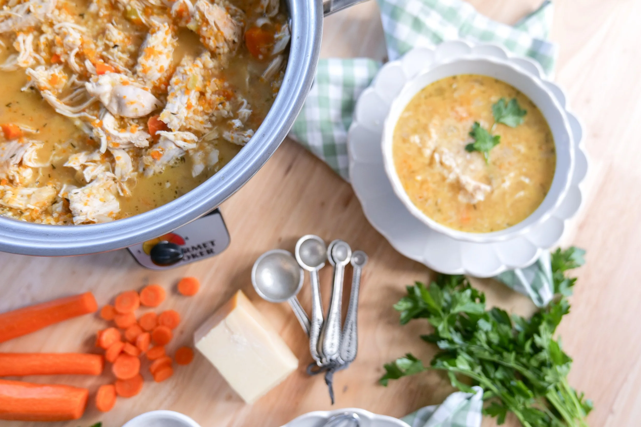 Cozy slow cooker pastina soup with chicken, vegetables and Parmesan ready to serve.