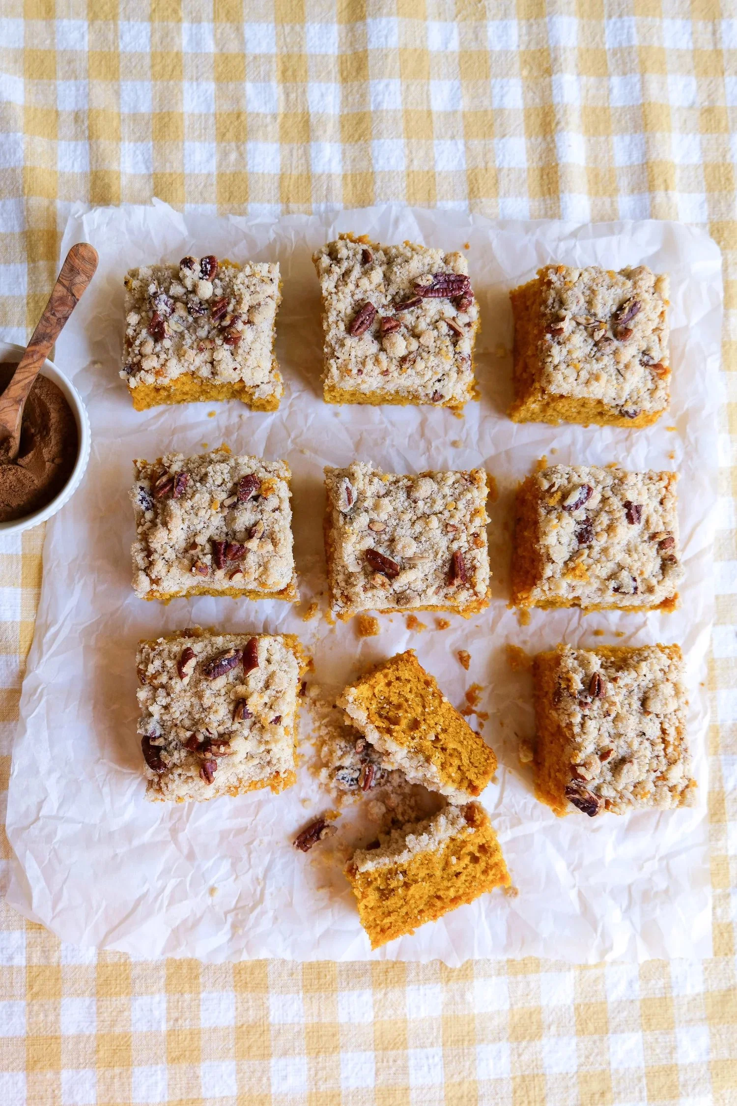 Slice of pumpkin coffee cake with a crunchy pecan crumble topping.