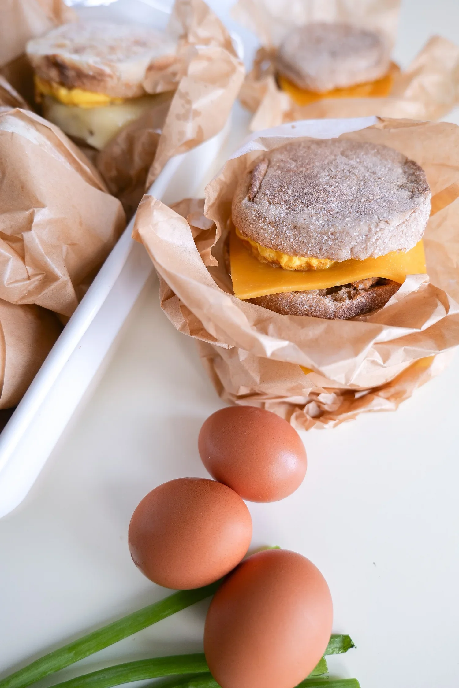 Make-ahead sausage and egg English muffin sandwiches for easy breakfasts.
