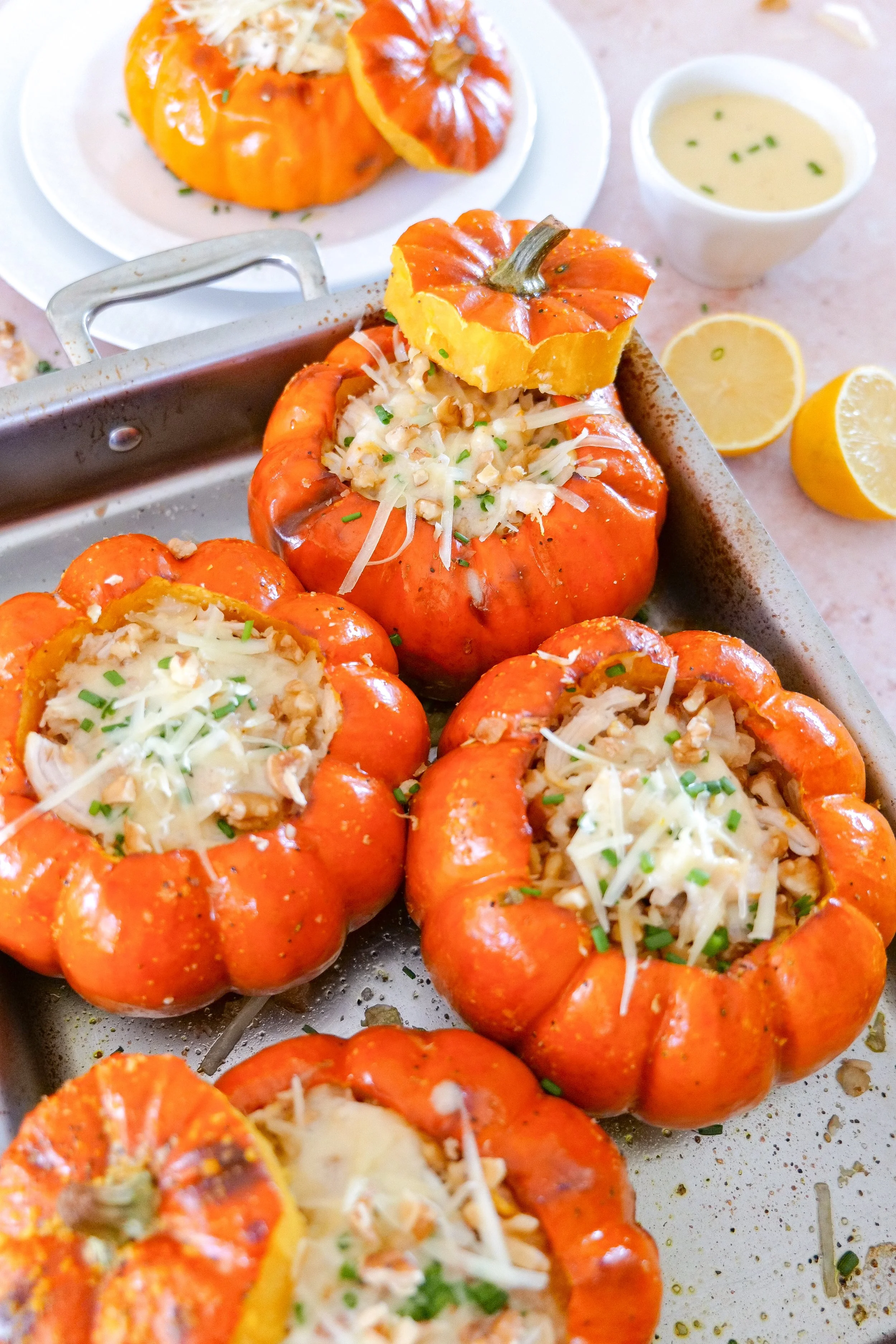 Roasted baby pumpkins served as edible bowls for a savory chicken and walnut filling.