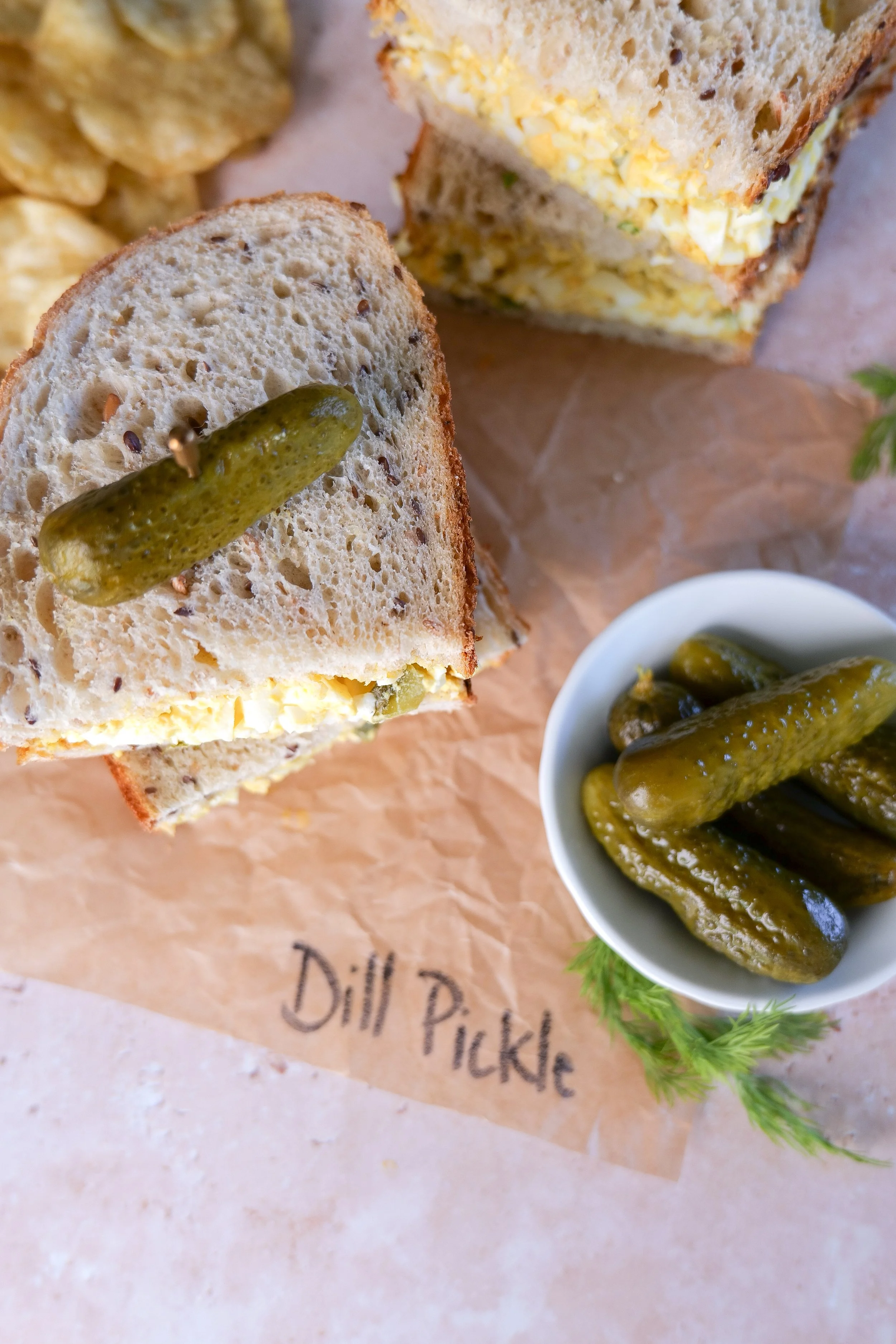Homemade dill pickle egg salad prepared with a creamy mayonnaise and Dijon dressing.  7. Sandwich Serving Image